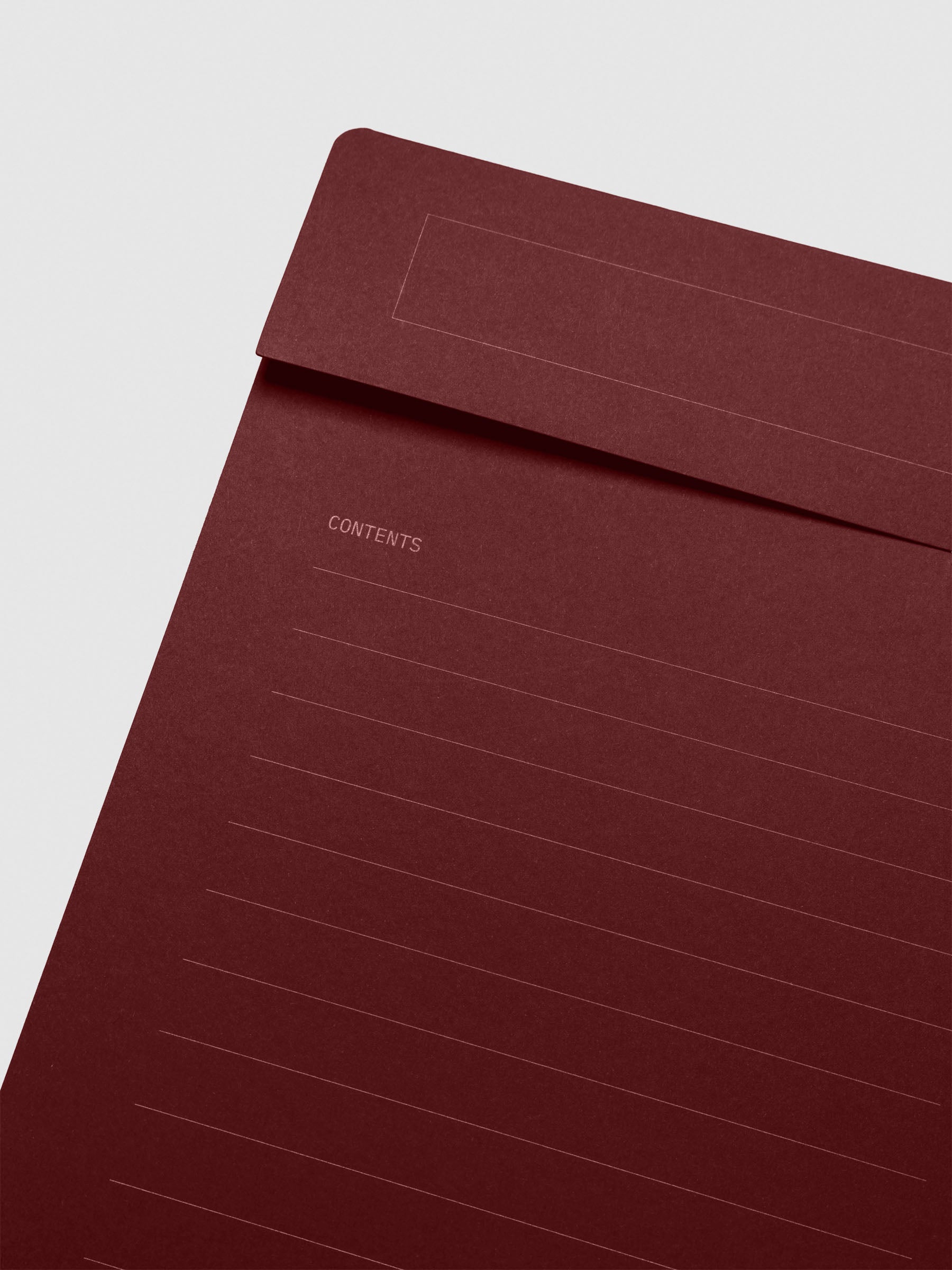 Close-up of the top-left corner of the folder front, focusing on the horizontal lines under the “Contents” heading.