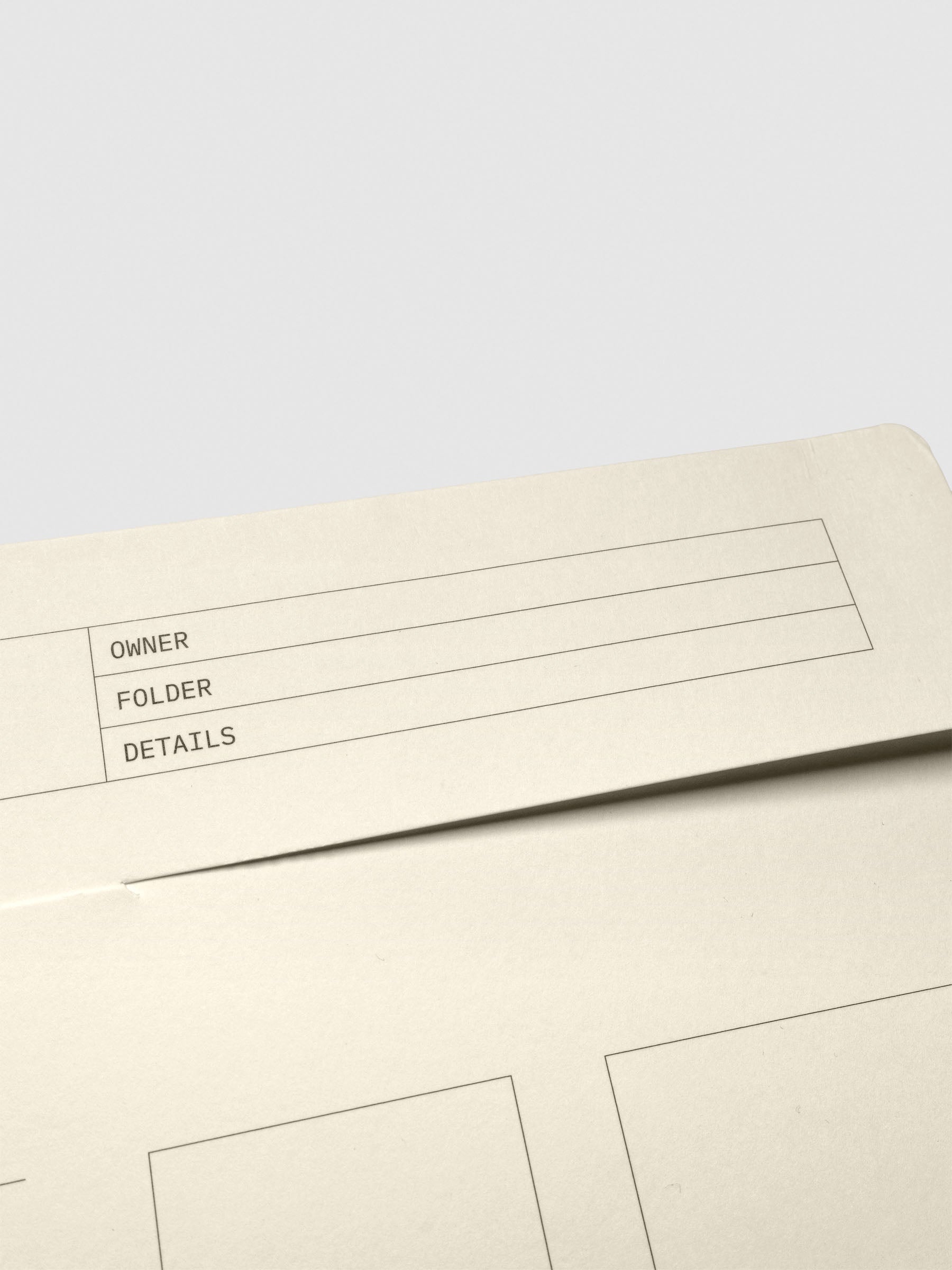 Close-up of the folder’s top flap showing labeled fields for Owner, Folder, and Details.