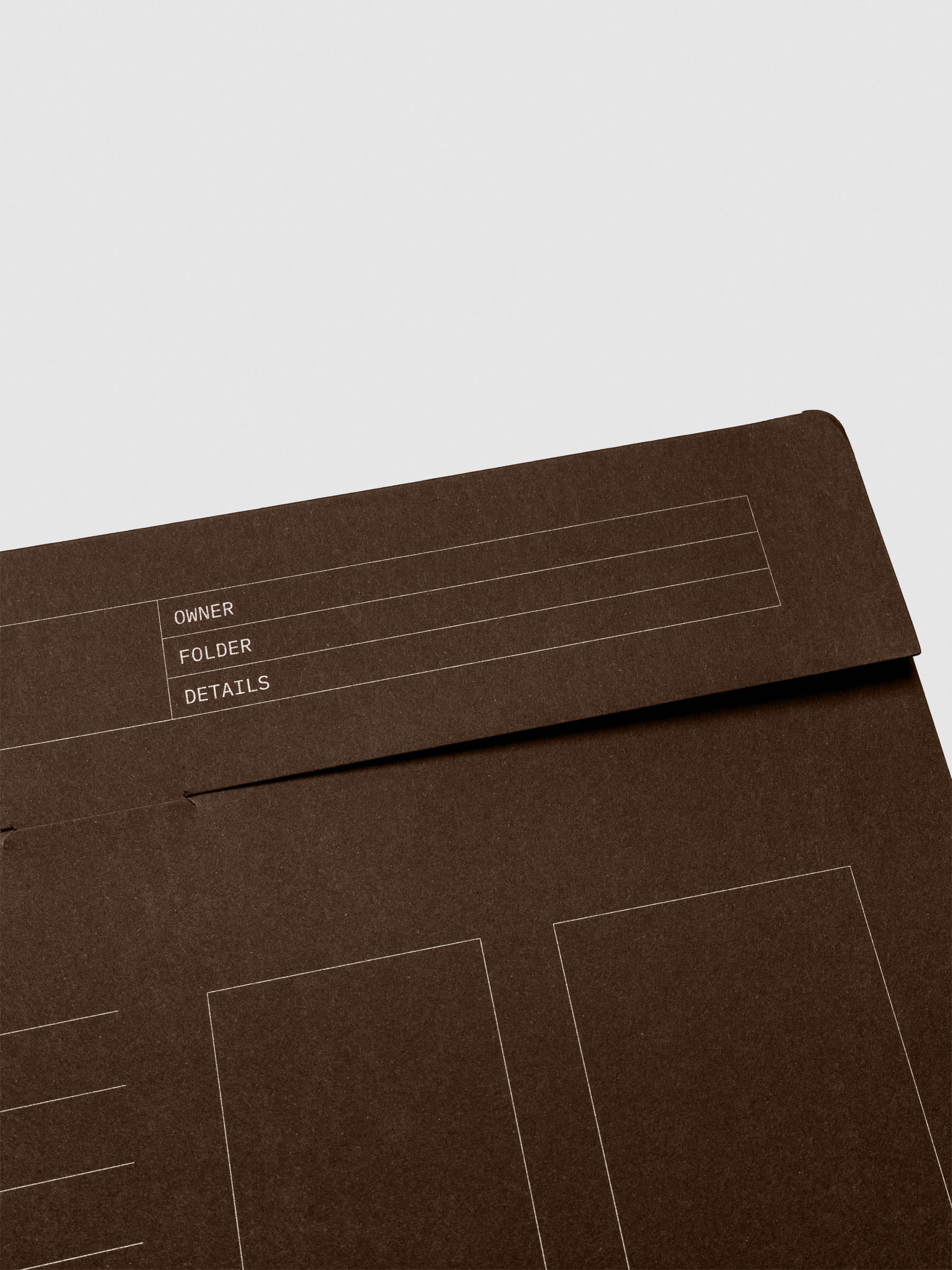 Close-up view of the flap tab on the espresso index folder, showing labeled lines for Owner, Folder, and Details.