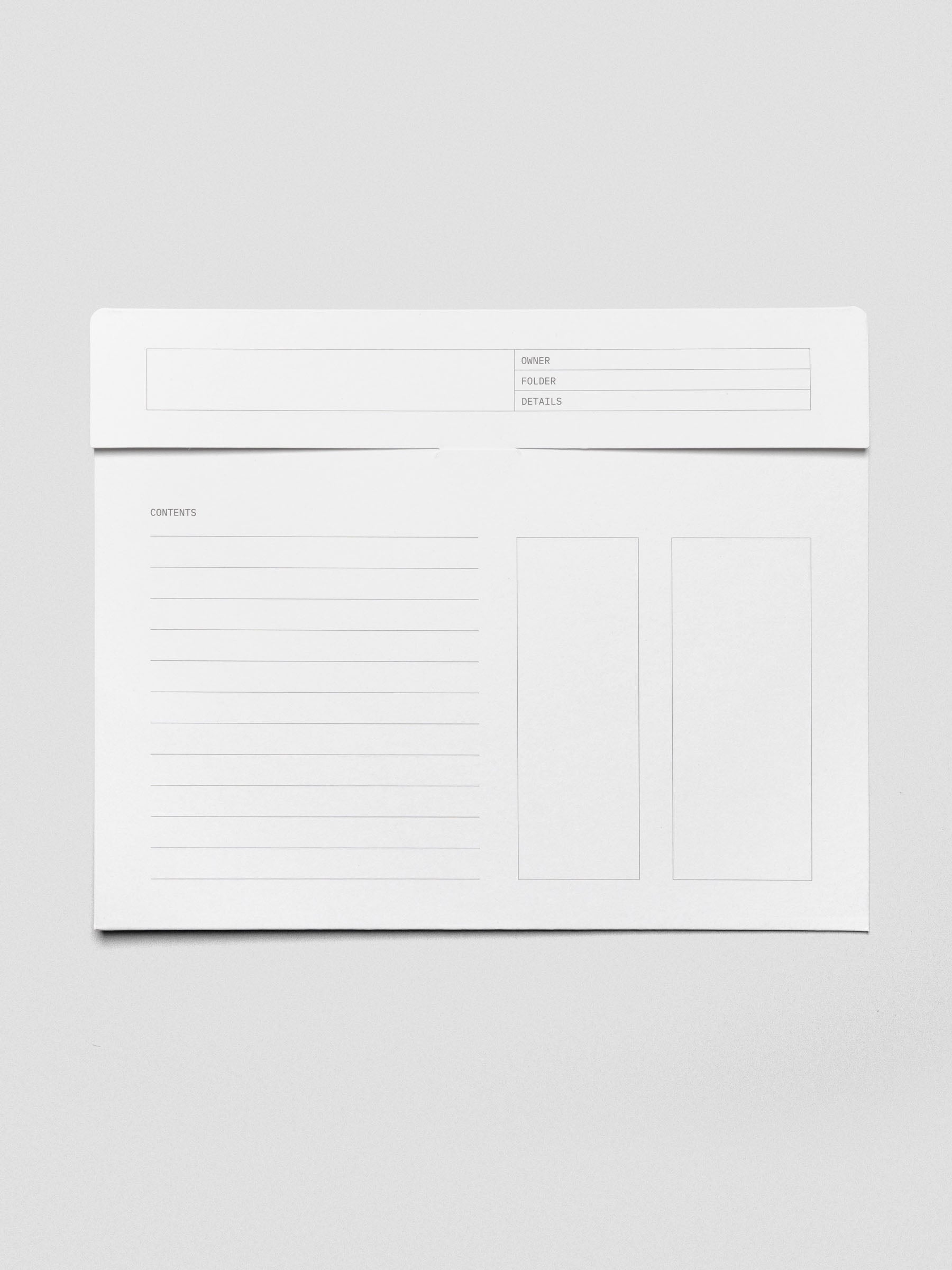 Flat lay of the white Index Folder, closed, with exterior labeling fields including “Owner,” “Folder,” “Details,” “Contents,” and outlined sections for notes.