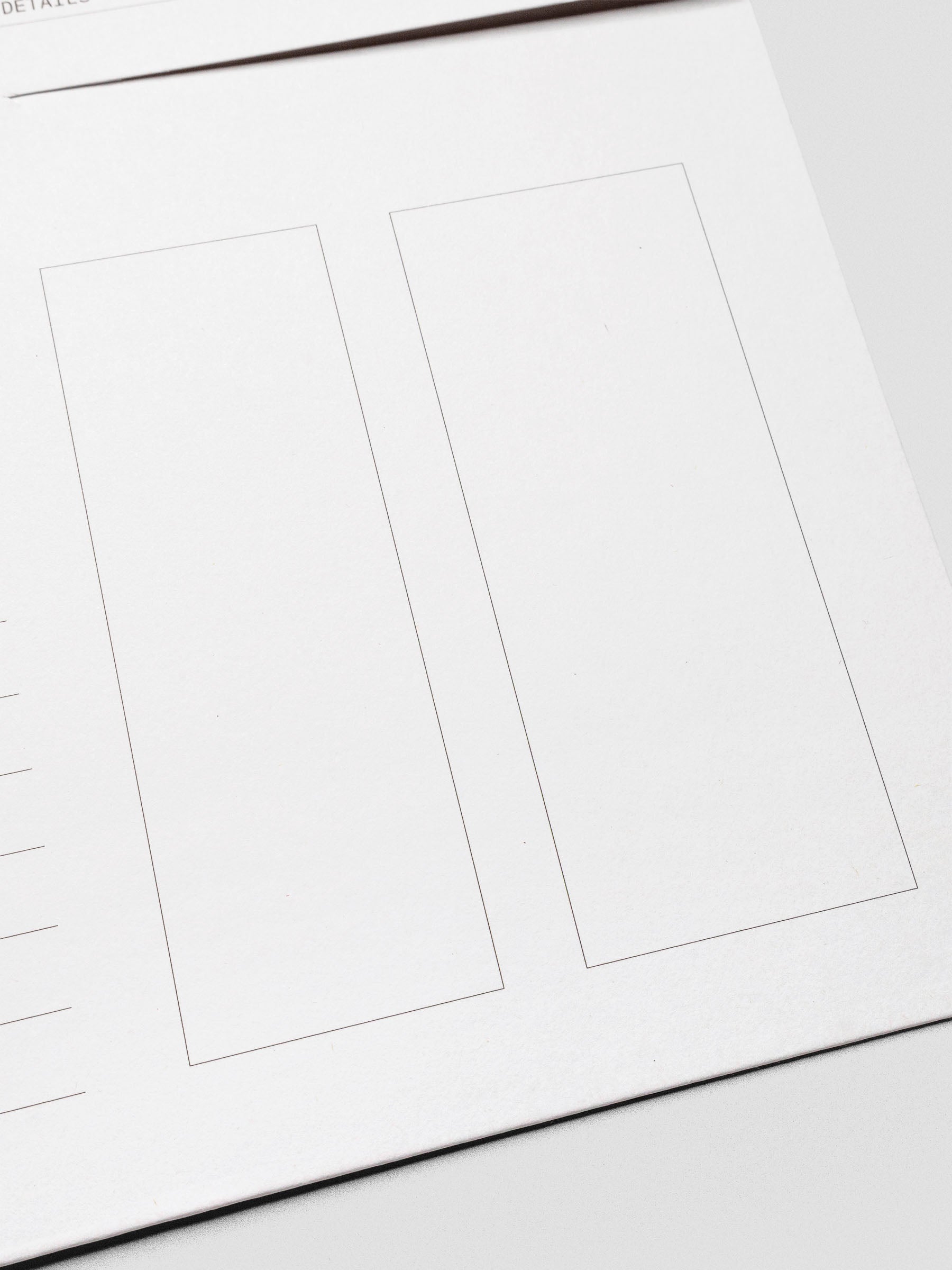 Detail view of the two outlined sections on the front of the white Index Folder, designed for sticky notes or additional organization.