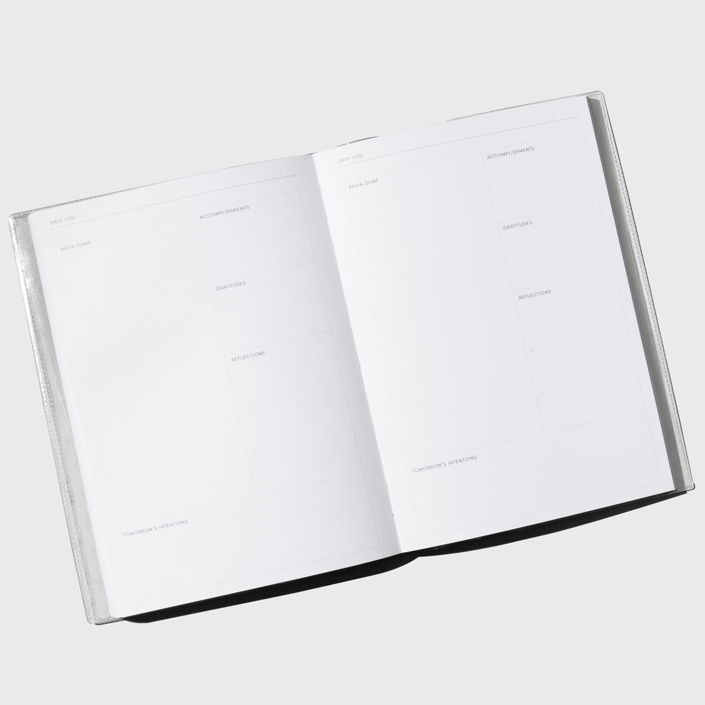 Opened notebook displayed on a neutral background.