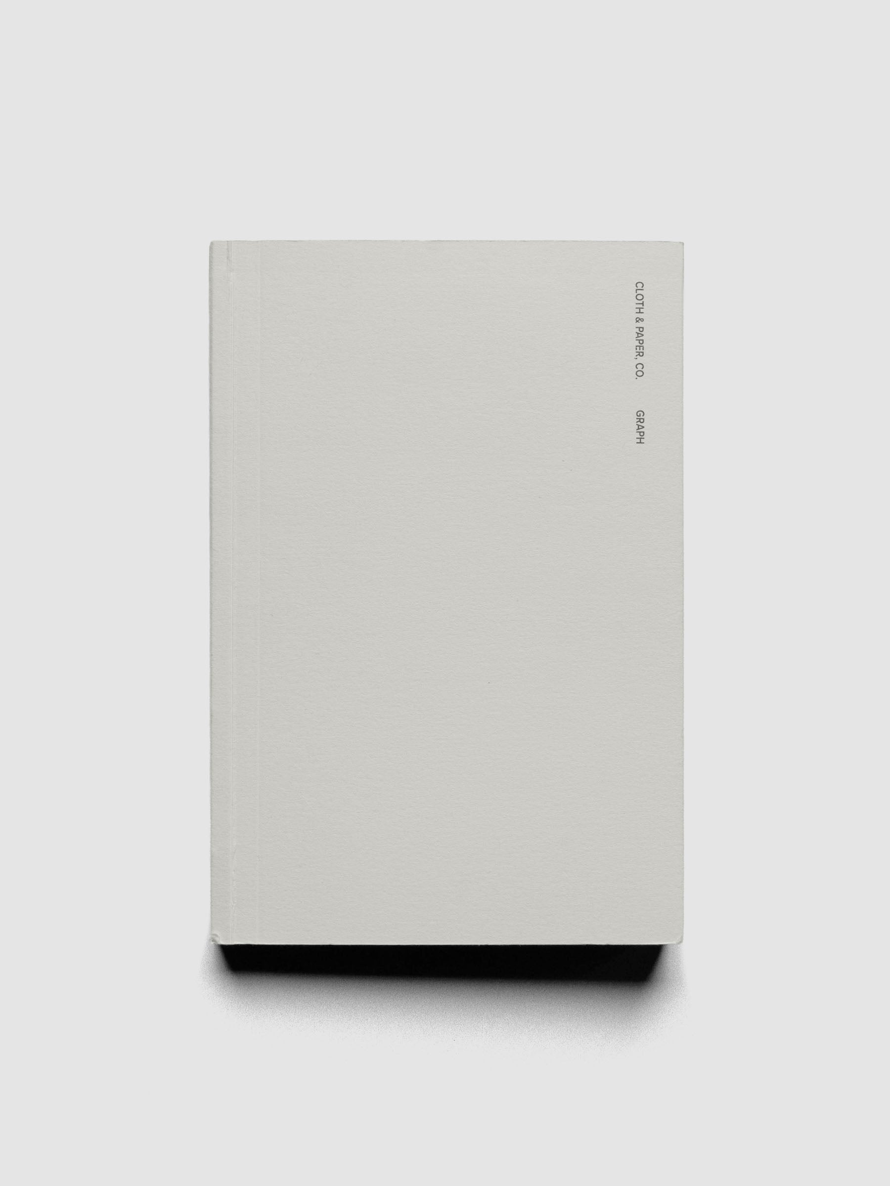 Inverted Graph Notebook in CP Petite shown closed from the front with a neutral cover.