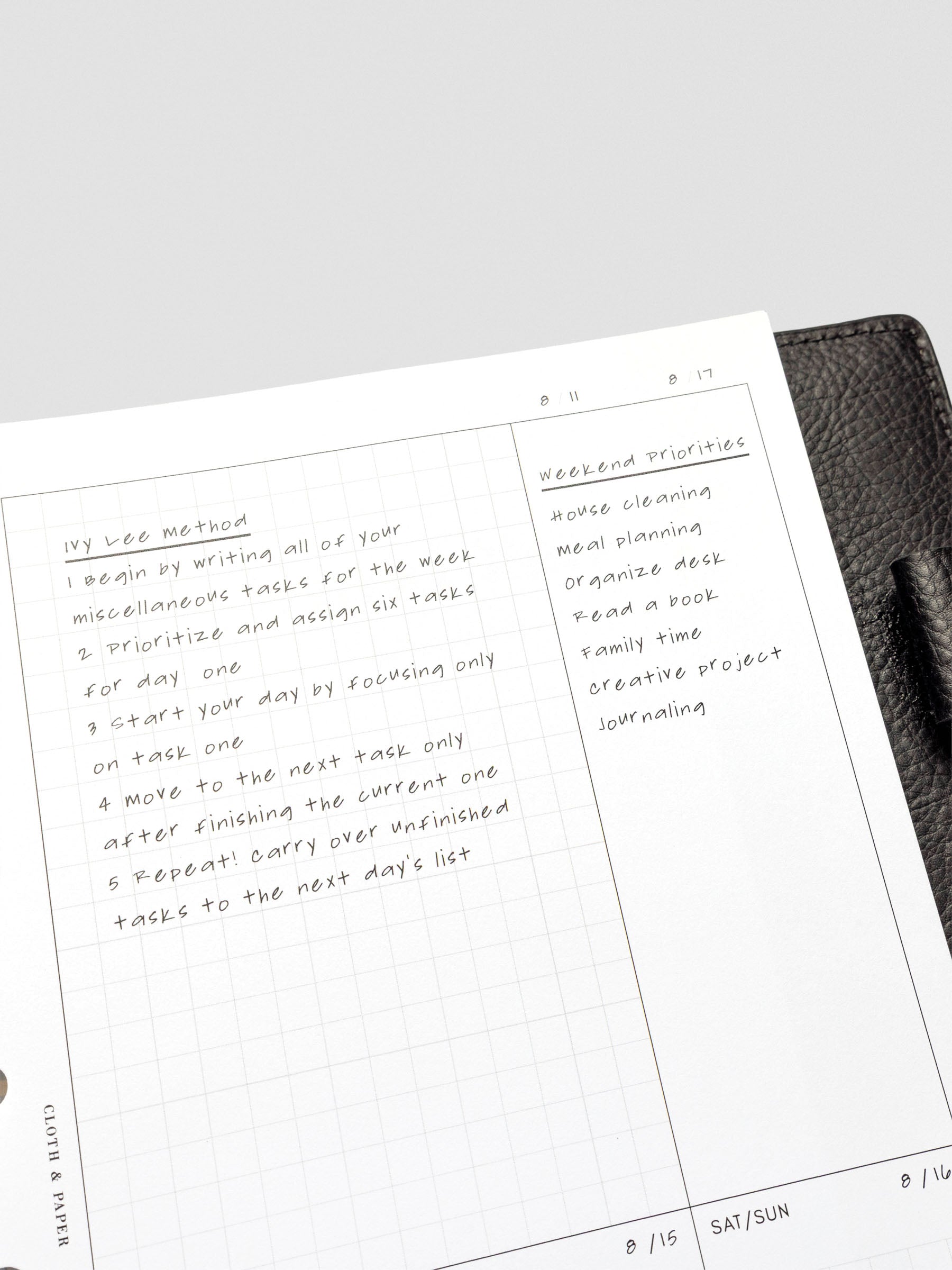 A detailed shot of handwritten notes using the Ivy Lee Method in the "Task Dump" area, alongside a weekend priorities section on the opposite page.