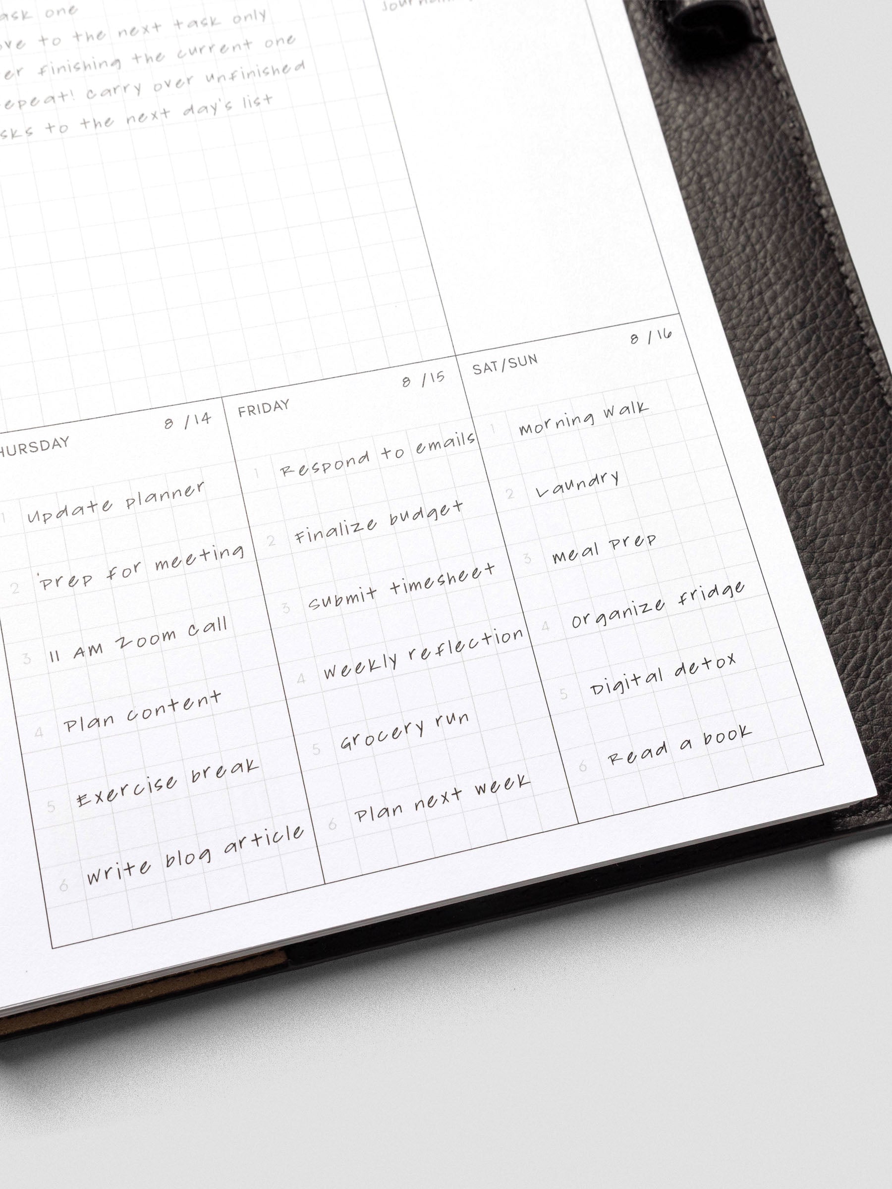 A close-up of Thursday through Sunday sections filled in with handwritten tasks, showing how each box is used for structured weekly planning.