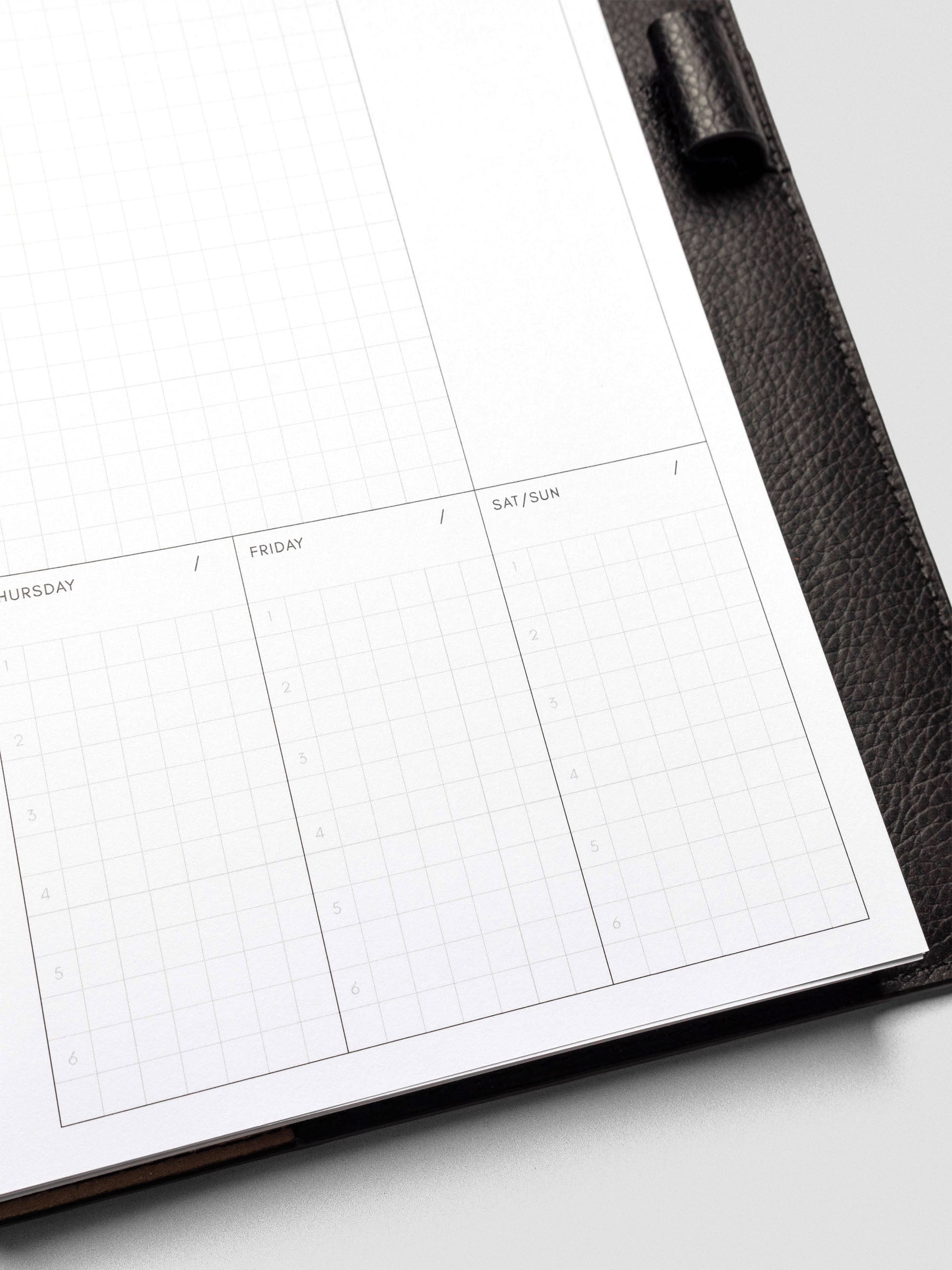 A clean view of the Friday and Saturday/Sunday sections of the planner insert, unfilled and ready for use, showcasing the six-line structure.