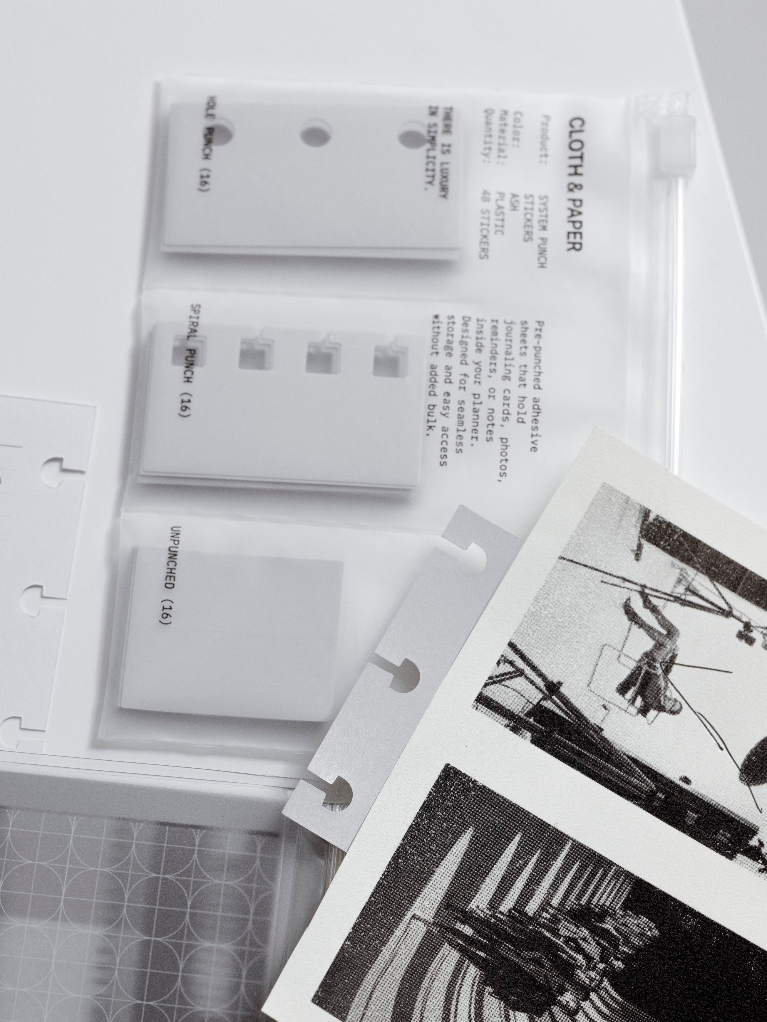 Ring bound variant of system punch stickers in clear zippered bag with decorative page on top and disc system punch sticker applied.