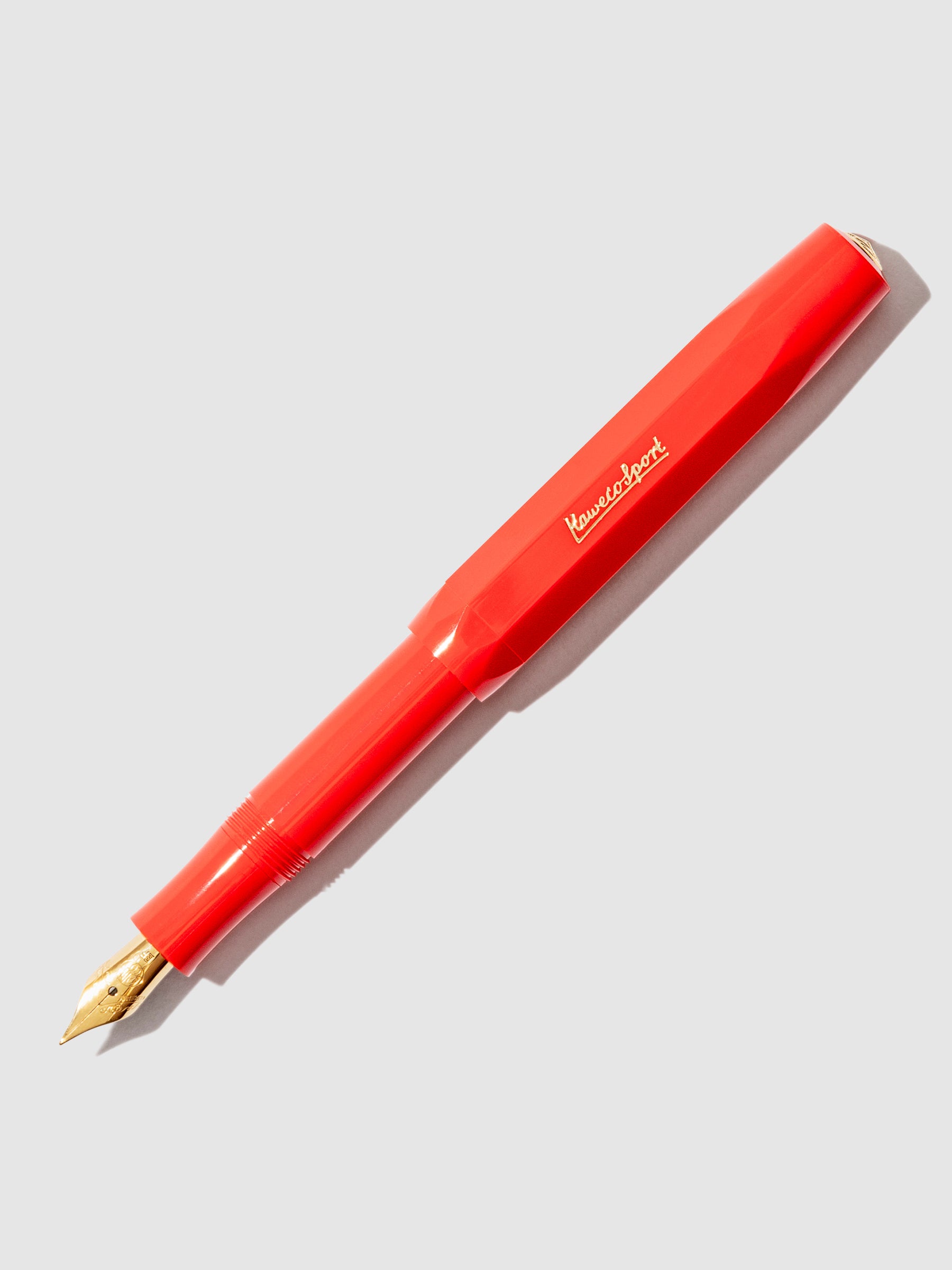 Pen displayed on a neutral background. The pen's nib is exposed.