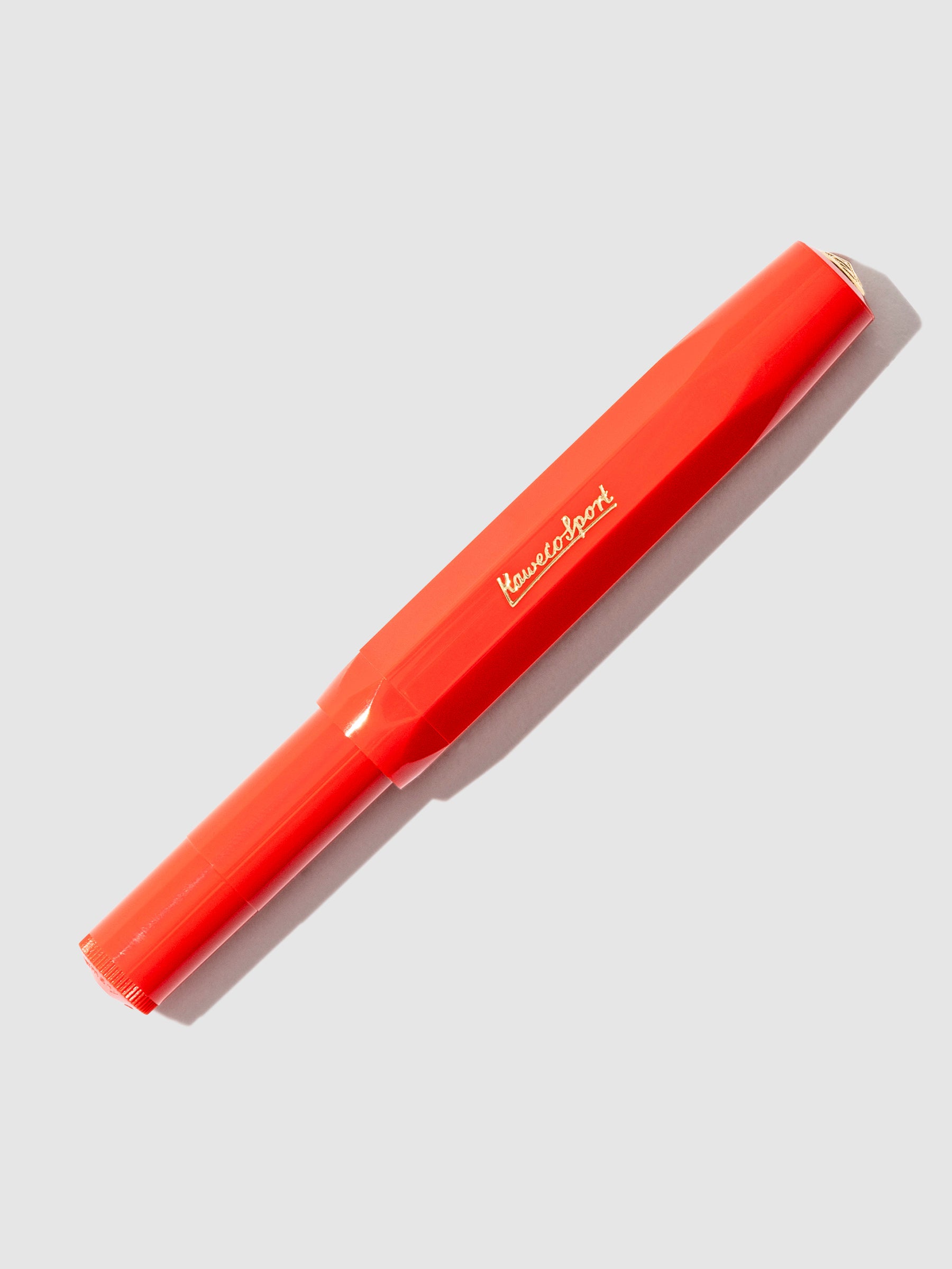 Red pen displayed on a neutral background.