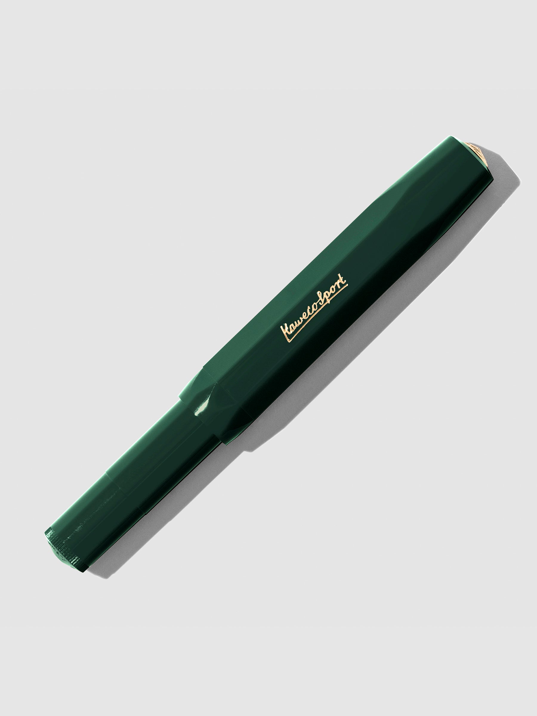 Dark Green Rollerball pen displayed with cap on a neutral background.