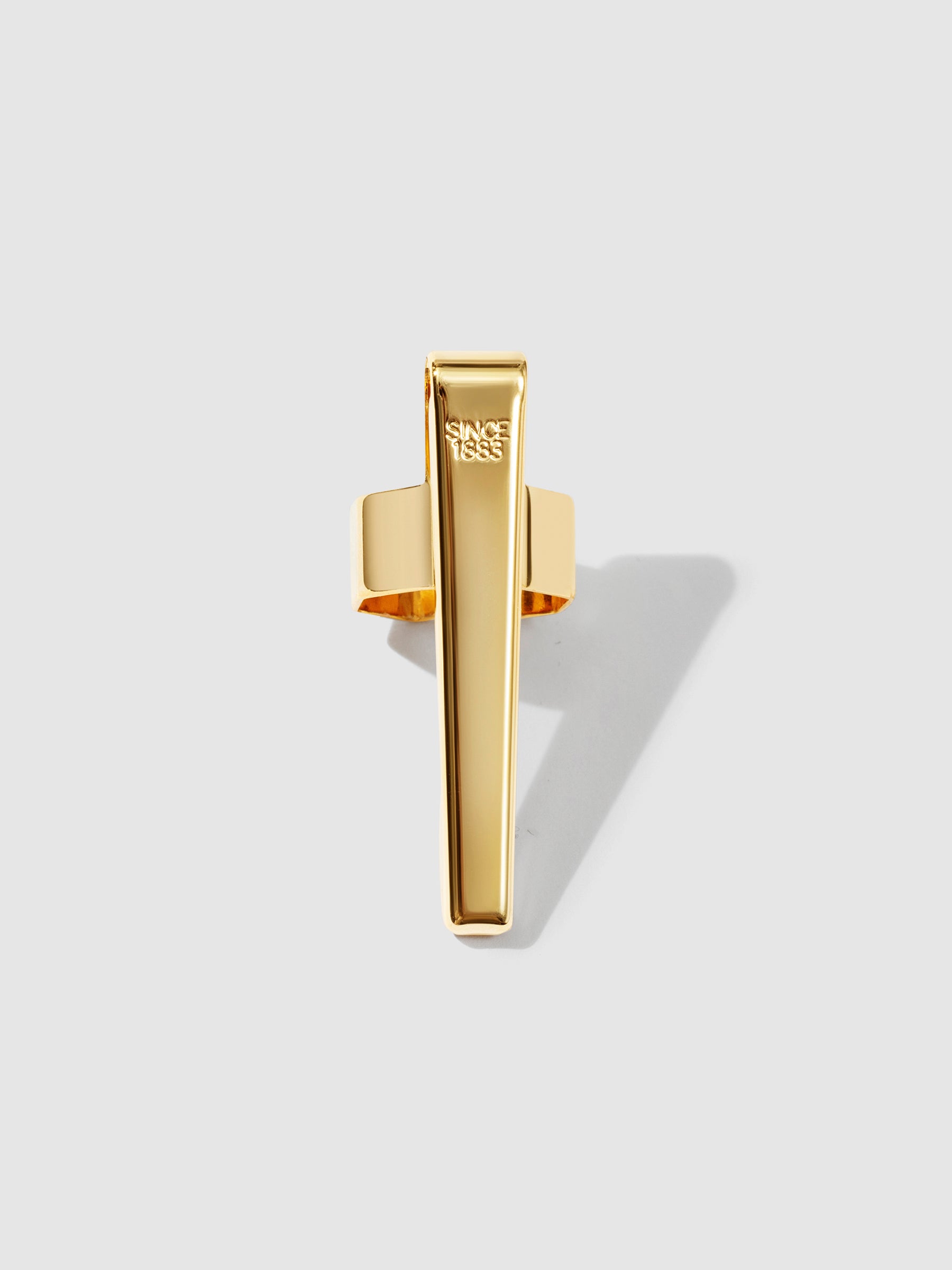 Standard gold clip displayed on a neutral background.