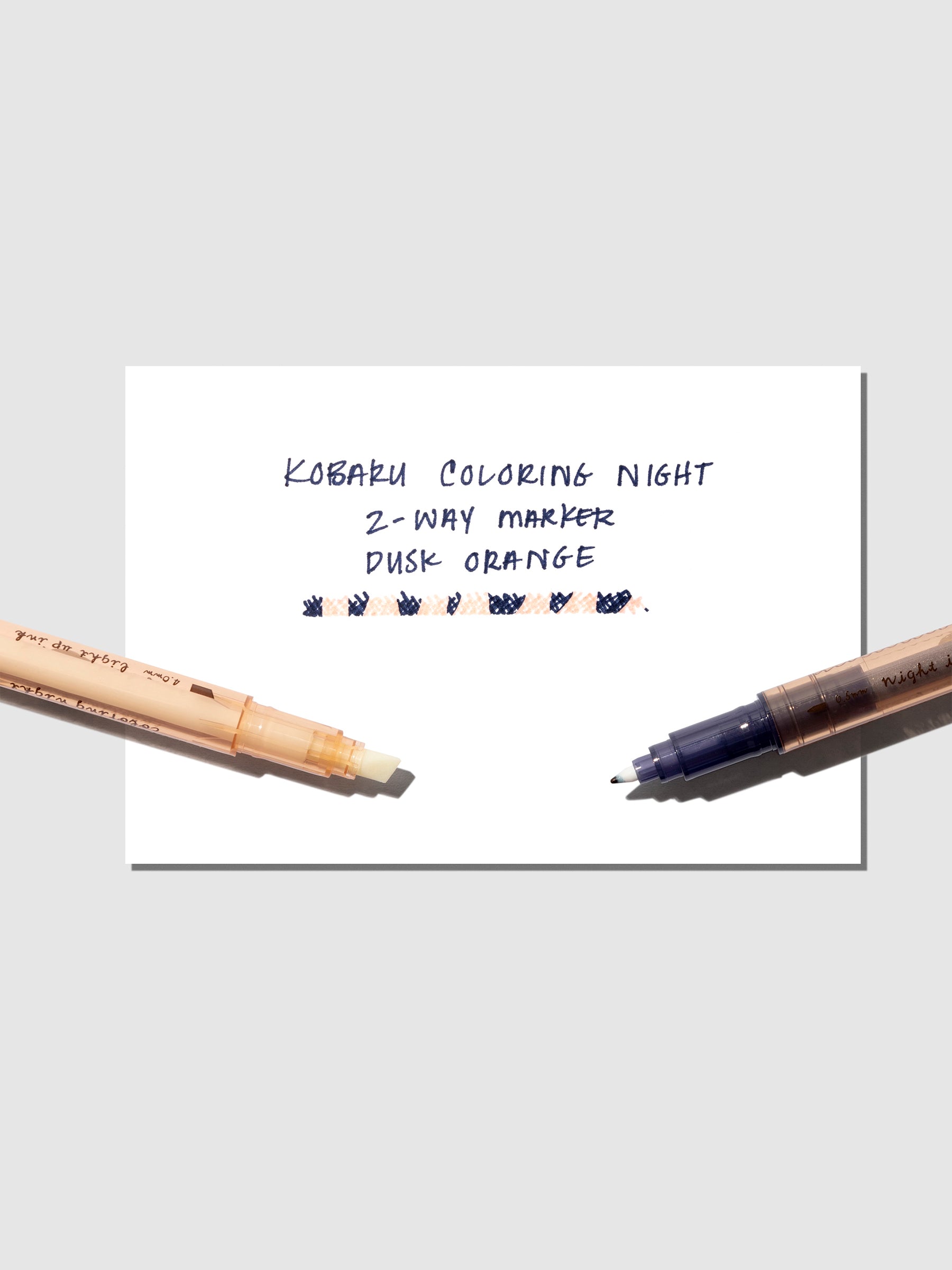 Marker shown with pen testing sheet on a neutral background.