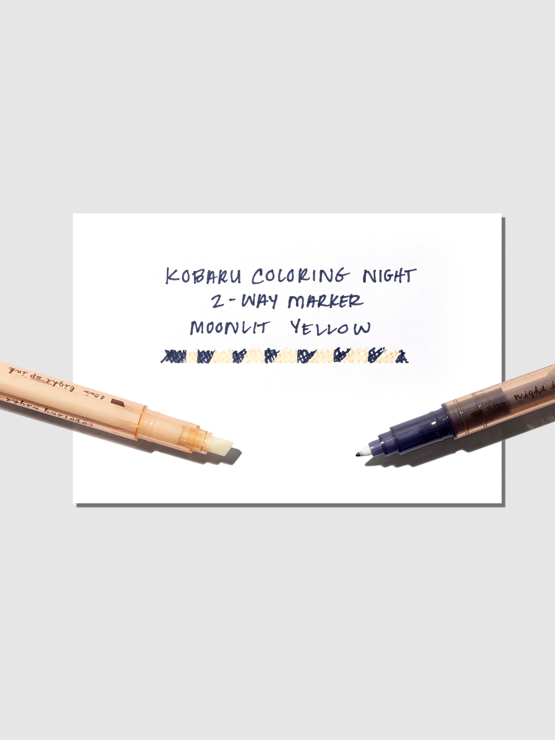 Marker shown with pen testing sheet on a neutral background.