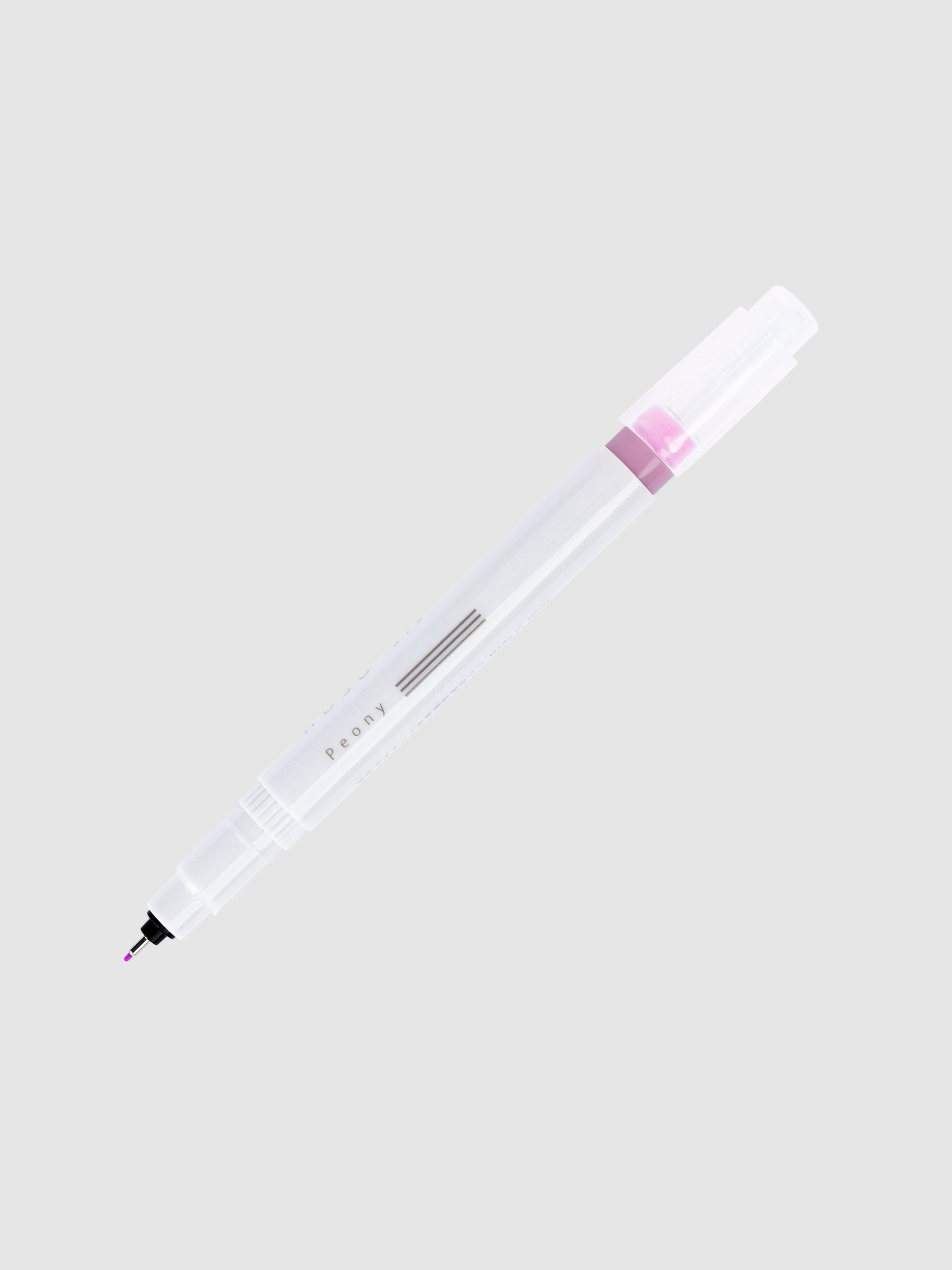 Fineliner marker in Peony with nib exposed and cap posted to the end of its barrel on a neutral background.