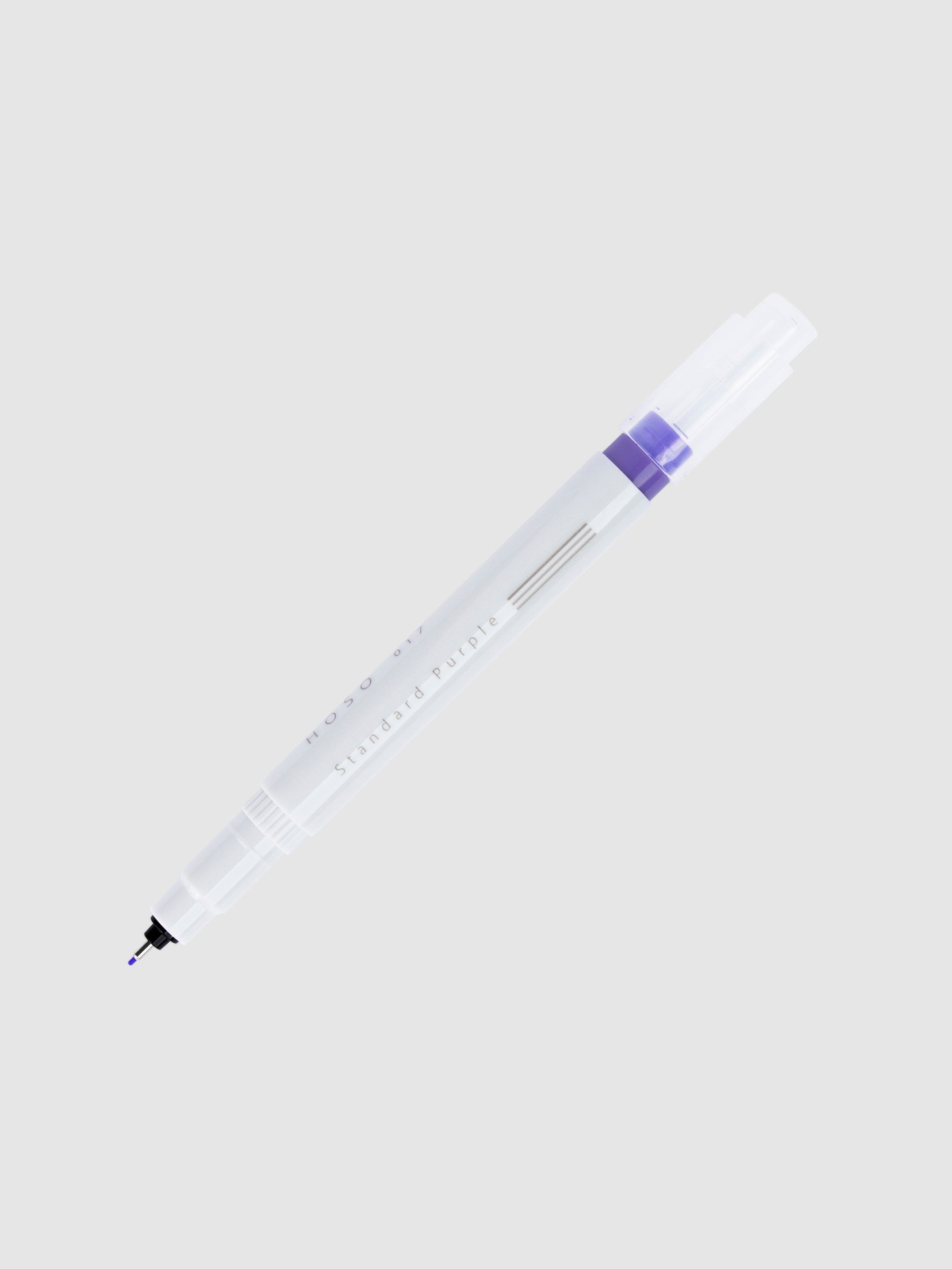 Fineliner marker in Standard Purple with nib exposed and cap posted to the end of its barrel on a neutral background.