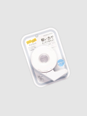 Kokuyo Karu Cut Tape Cutter, Small, Cloth and Paper. Tape cutter in its packaging turned slightly to the left against a neutral background.