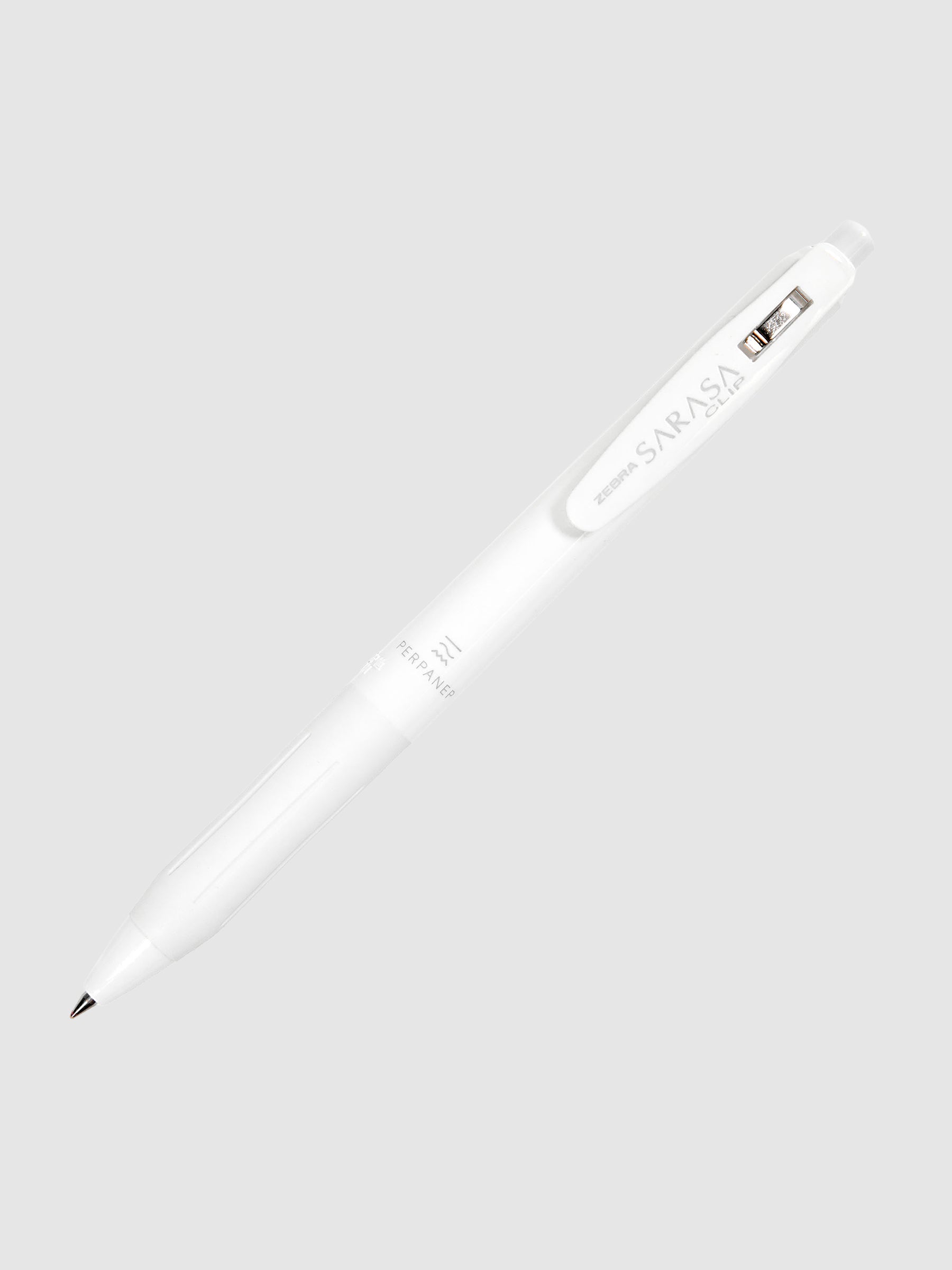 Kokuyo x Zebra Sarasa Clip Perpanep Pen, Cloth and Paper. Pen turned to the right against a neutral background with nib exposed.