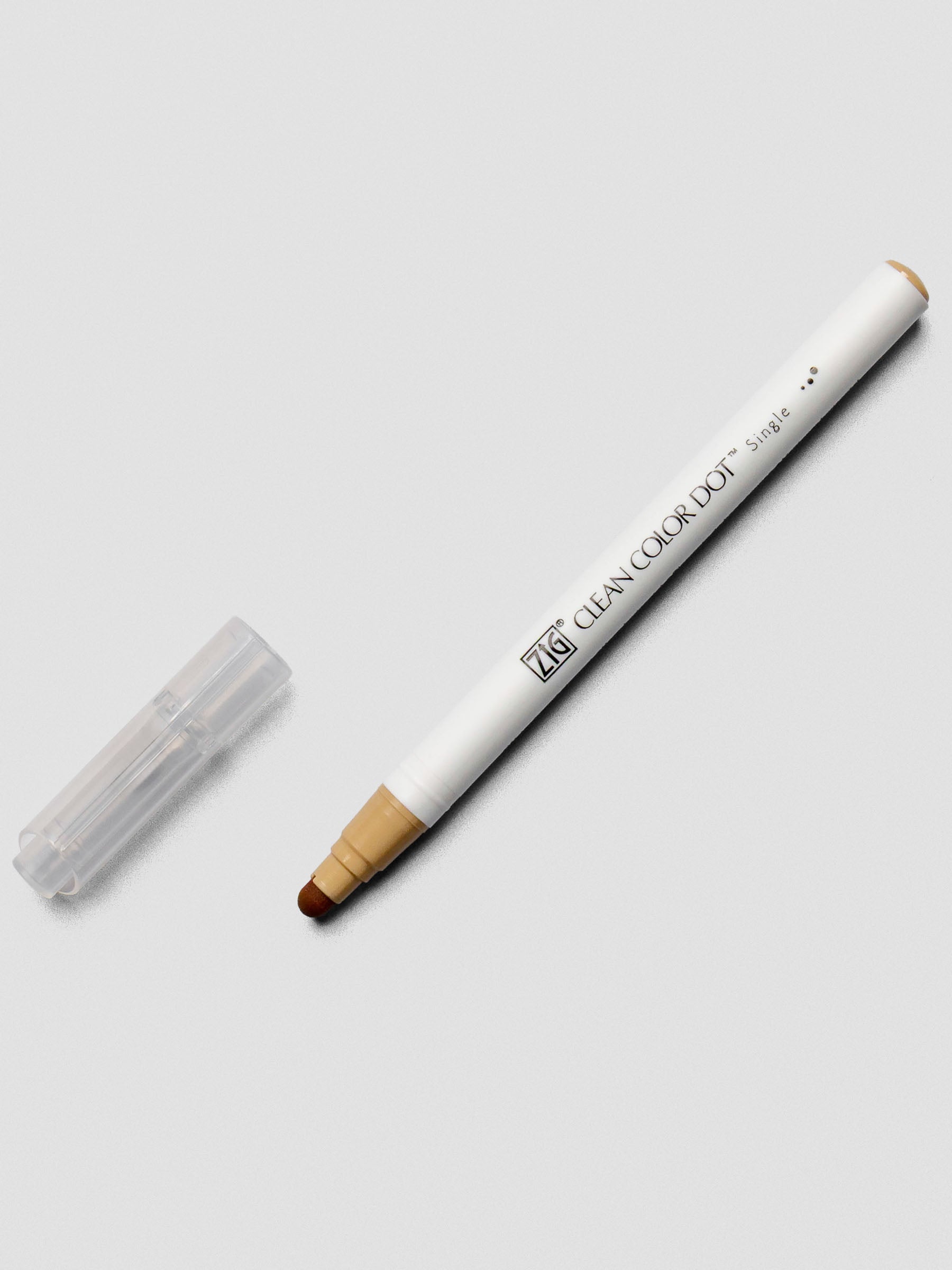 Oatmeal Kuretake ZIG Clean Color Dot Marker shown uncapped with the flexible bullet tip visible.