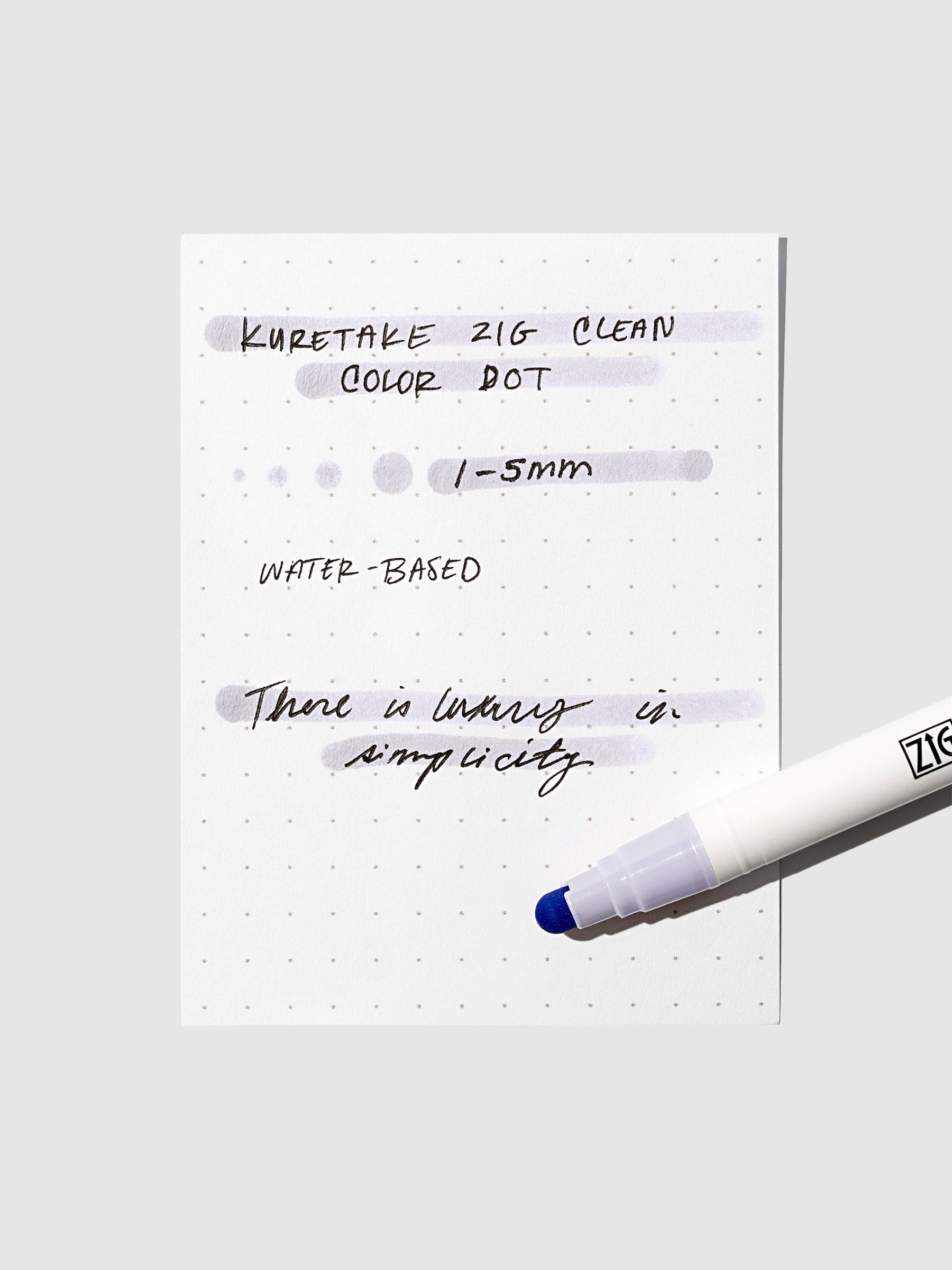 Dot marker displayed on top of an in use pen testing sheet. Color shown is English Lavender. 