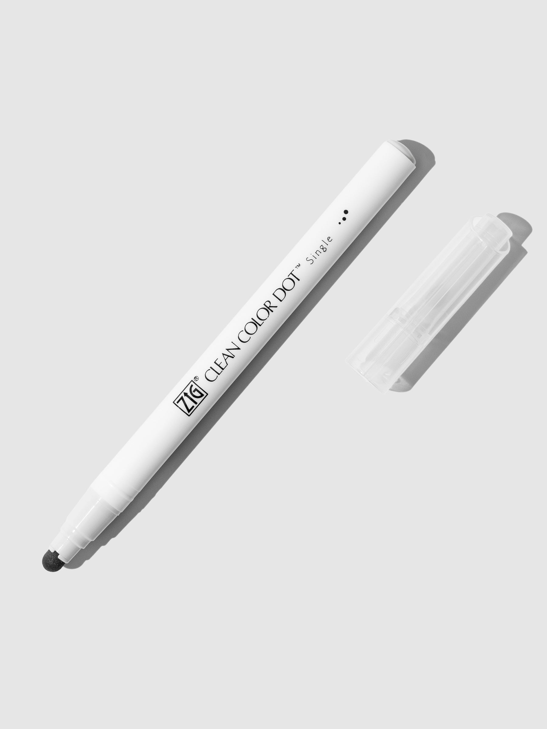 Kuretake Zig Clean Color Dot Marker in Light Platinum displayed uncapped on a neutral background.