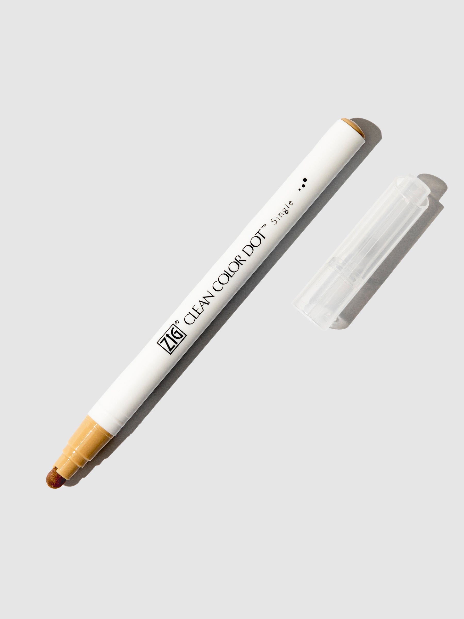 Kuretake Zig Clean Color Dot Marker in Marker Oatmeal displayed uncapped on a neutral background.