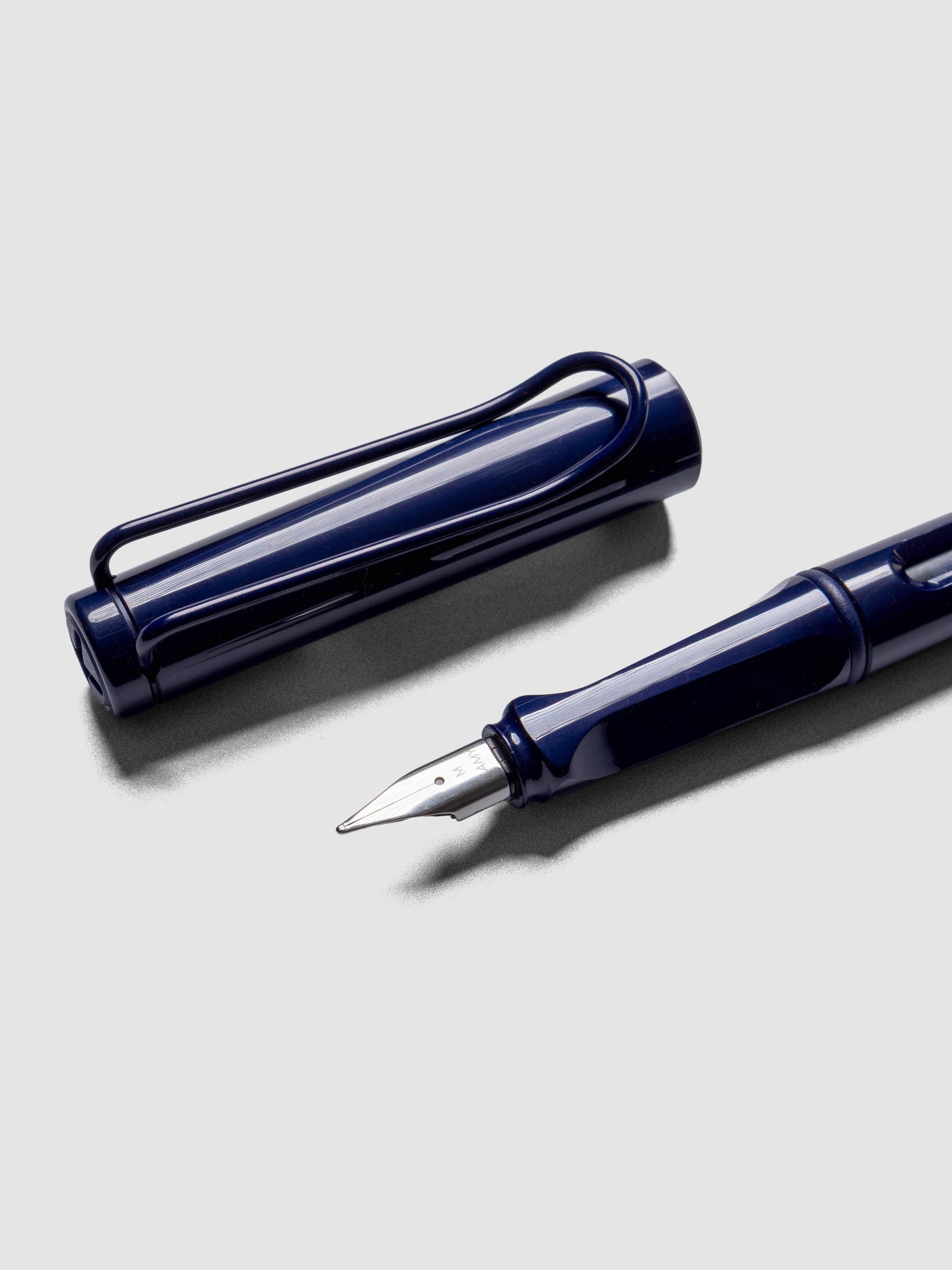 Close up of LAMY Safari Fountain Pen in the color Dark Dusk with Medium nib shown diagonally with the cap off. 