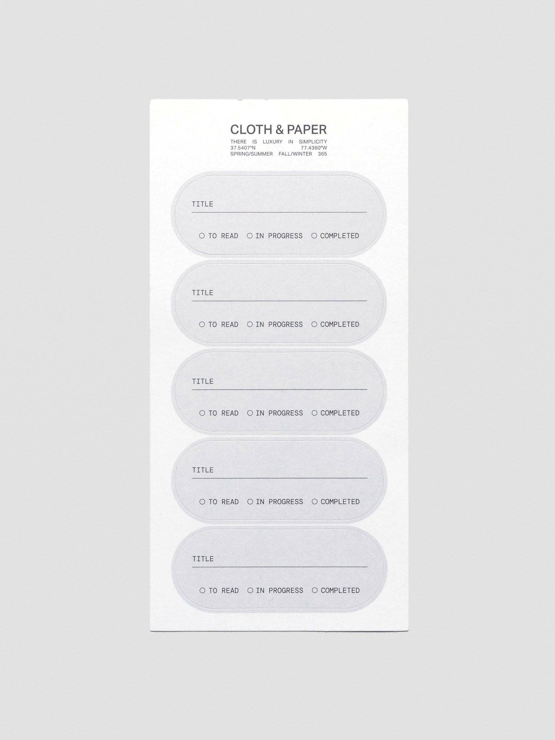 A sheet of five grey, pill shaped labels with a field for title and options to mark 'to read', 'in progress', or 'complete'.