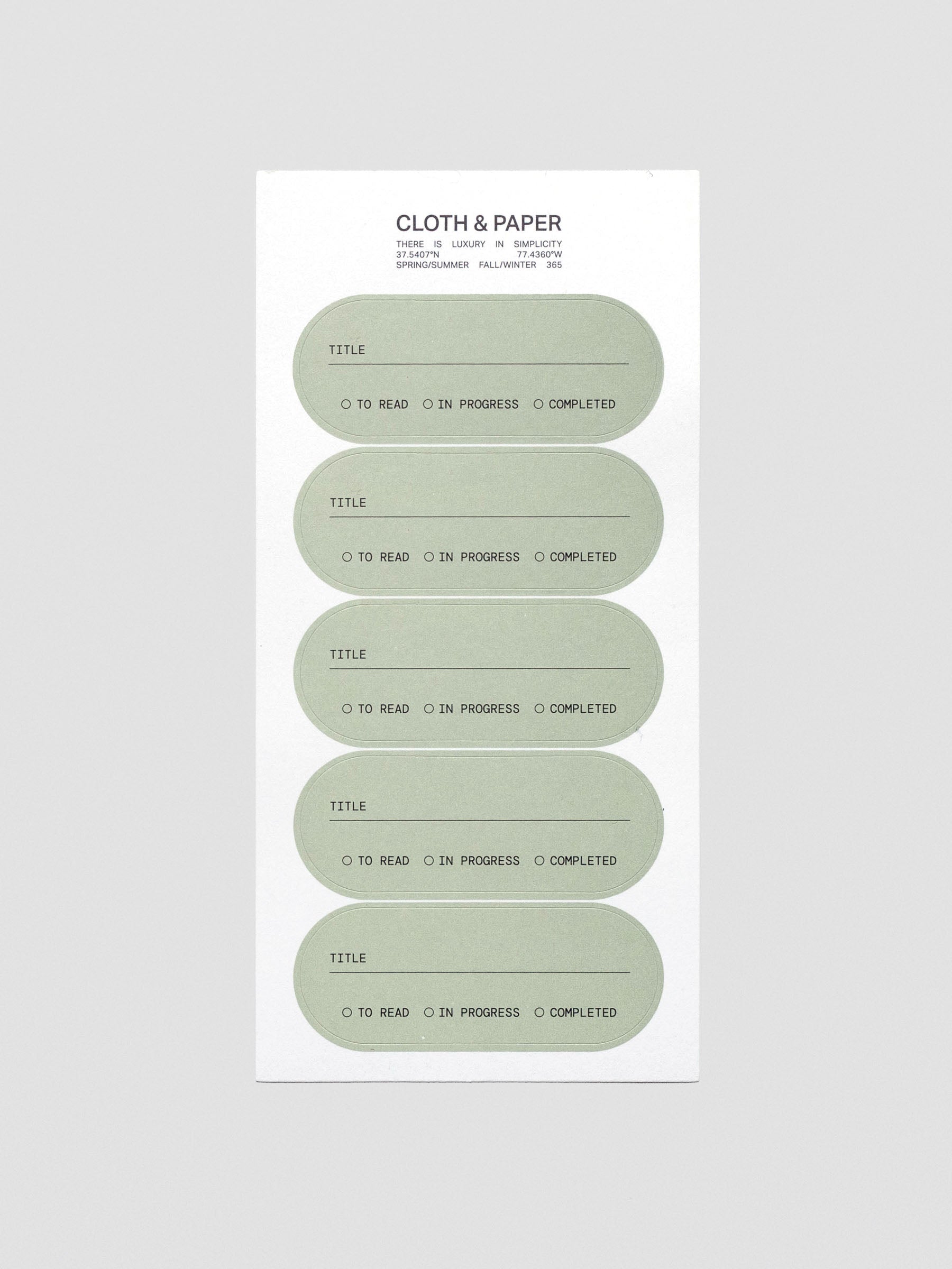 A sheet of five green, pill shaped labels with a field for title and options to mark 'to read', 'in progress', or 'complete'.