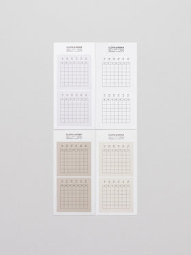 Four sheets of Cloth & Paper Label Planner Stickers titled "Calendar," displayed on a light grey background. Each sheet features minimalist grid calendar stickers in neutral tones, with the months listed at the top and a Sunday-to-Saturday grid layout below for flexible monthly planning.