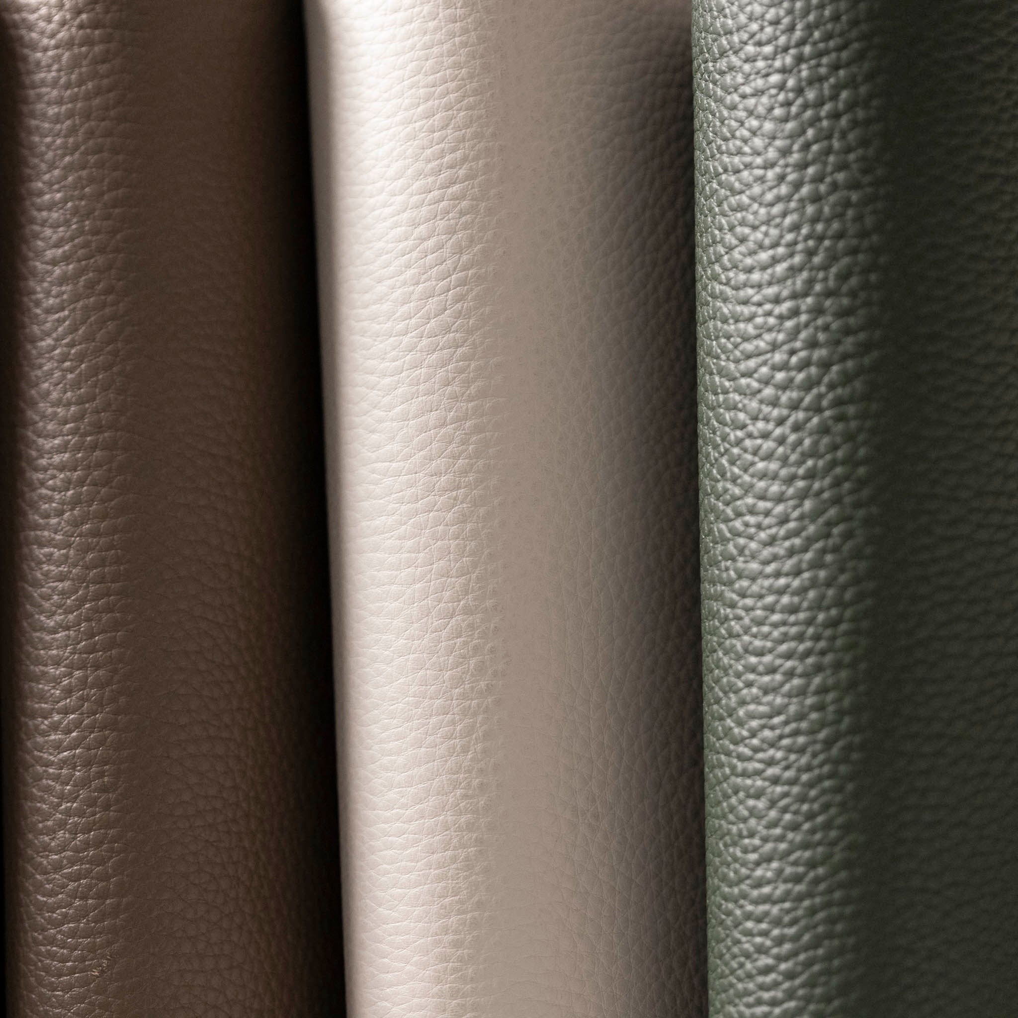 The spines of a few Foundations Leather 6-Ring Agendas are side by side.