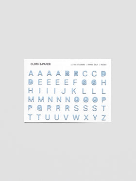 One sheet of blue grey raised letter stickers.