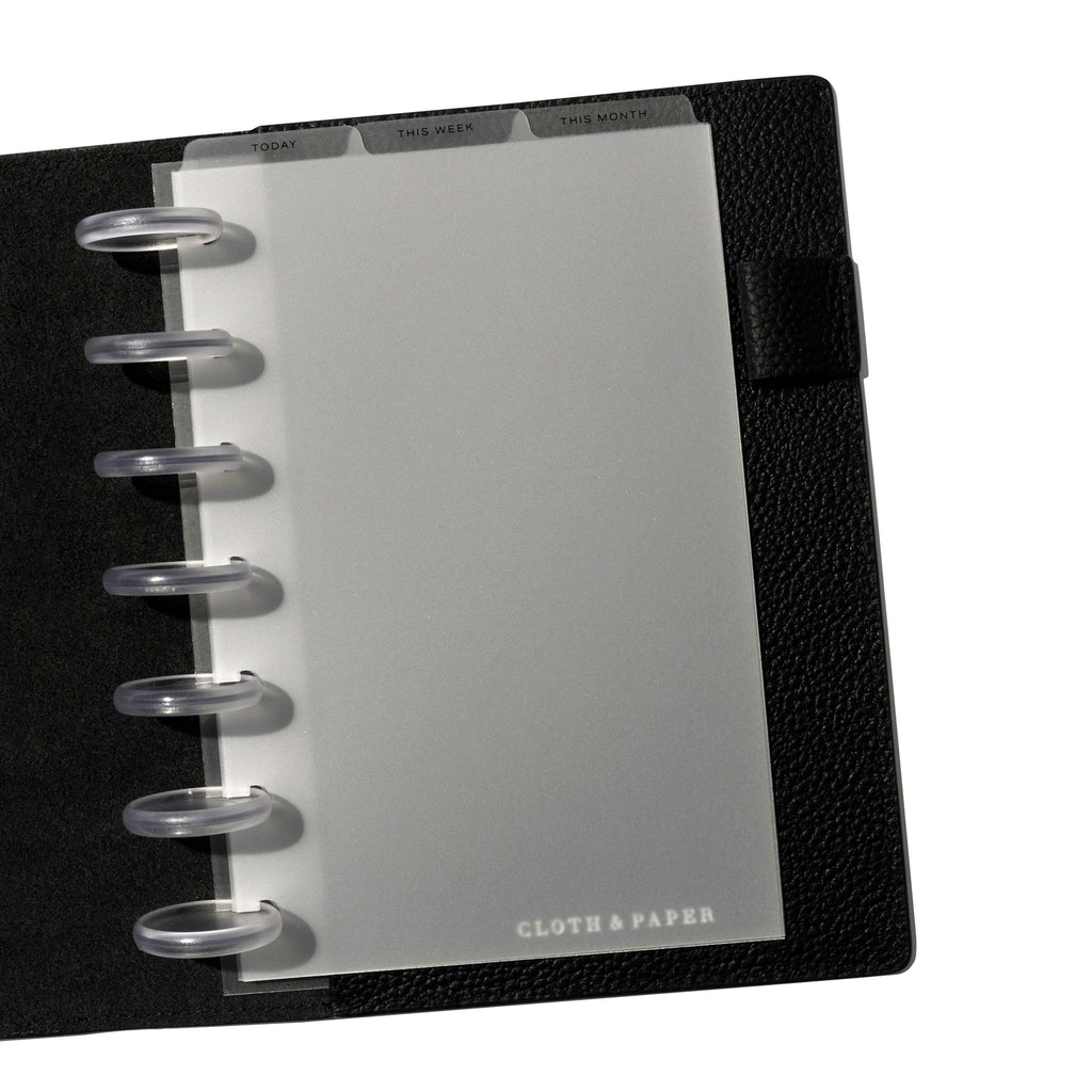 HP Mini Black Foil Cadence Tab Dividers displayed in a black leather planner.