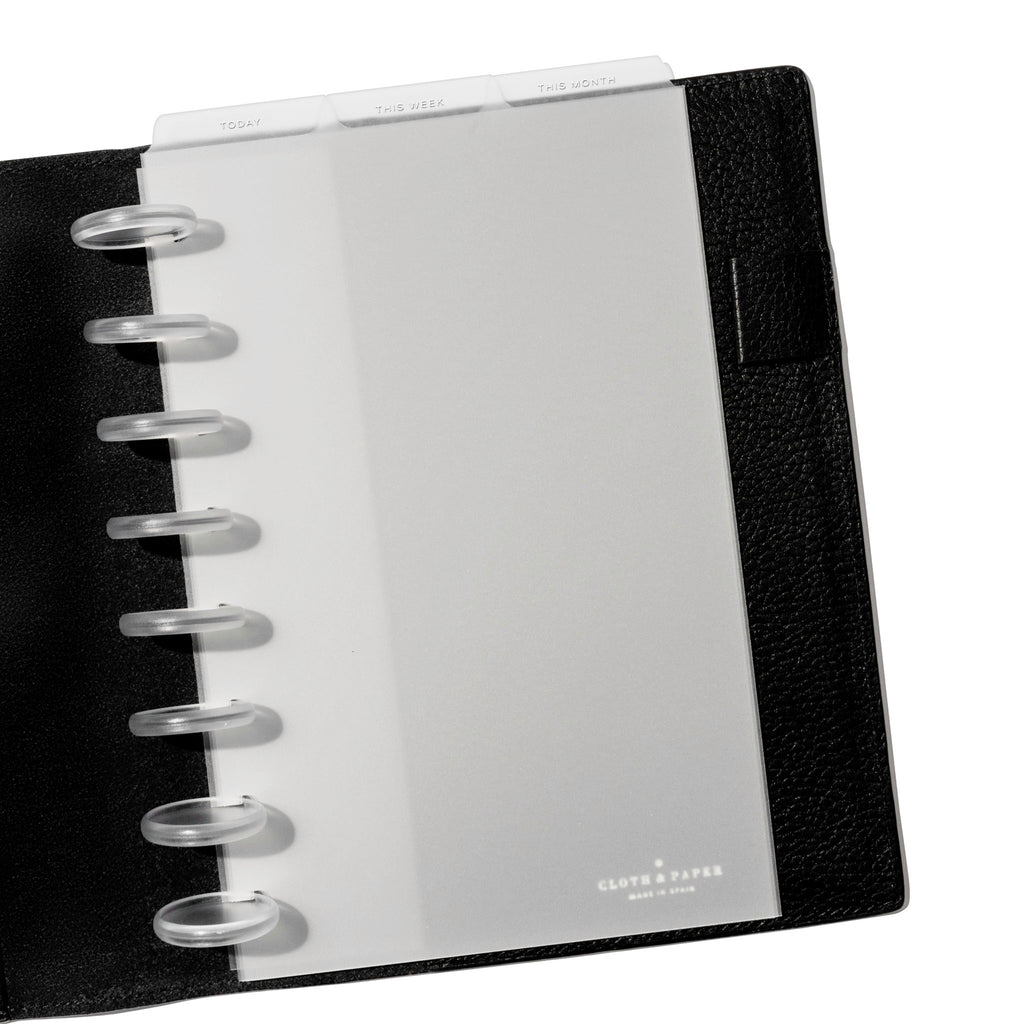 Half Letter White Foil Cadence Tab Dividers displayed in a black leather planner.