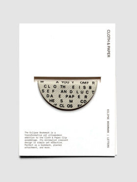 Magnetic Bookmark | Bookcloth | Letters shown in packaging on a neutral background.