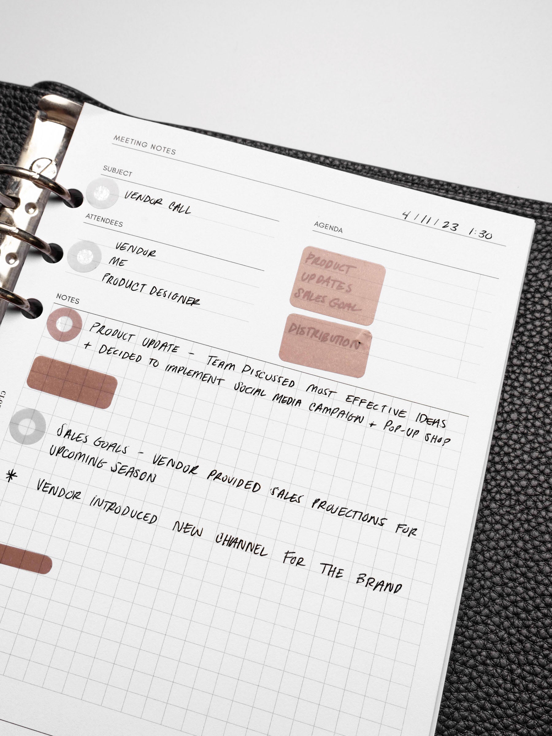 Insert in use inside a black leather planner.