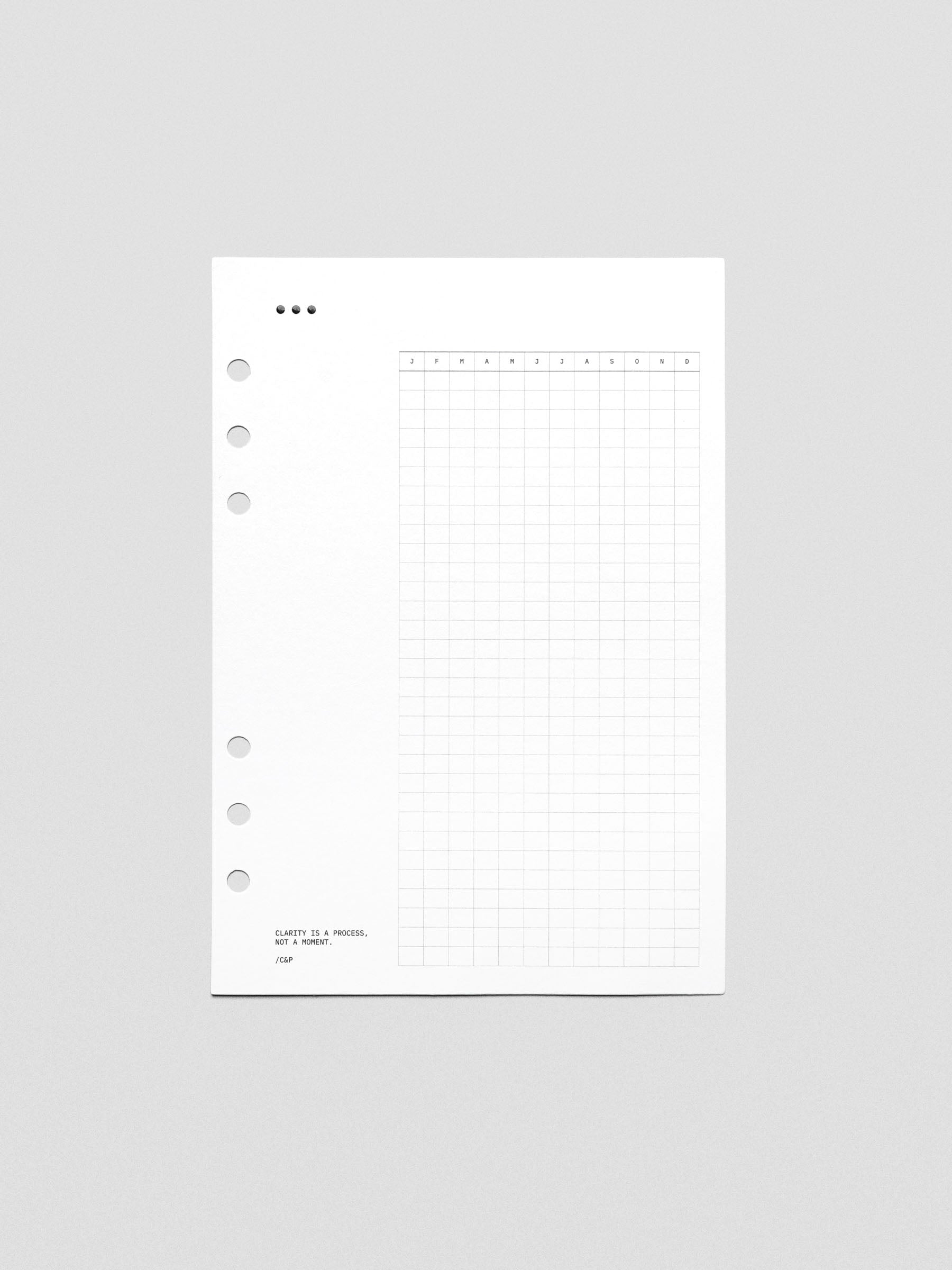 White cardstock planner dashboard with 3 dot design, habit tracker, and text design printed in black.