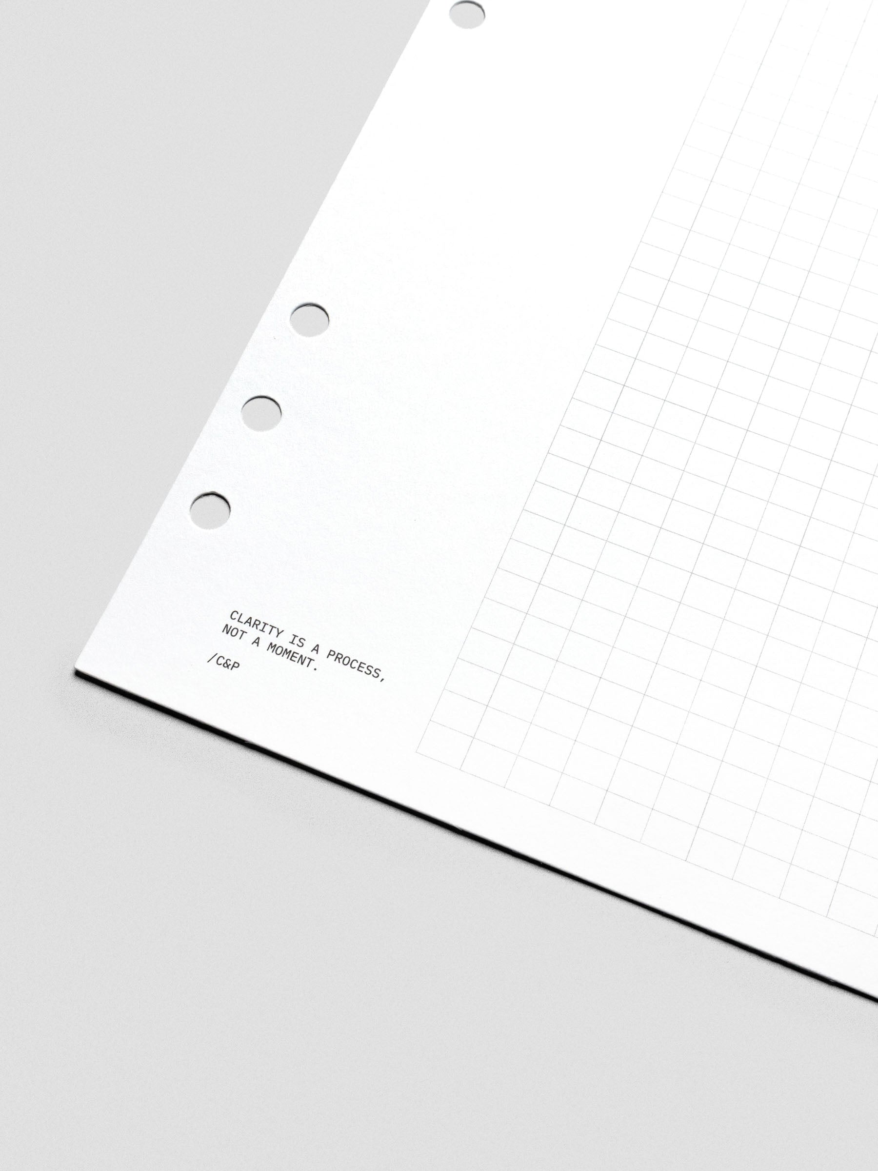 Close up of text design reading "Clarity is a process, not a moment / C&P".