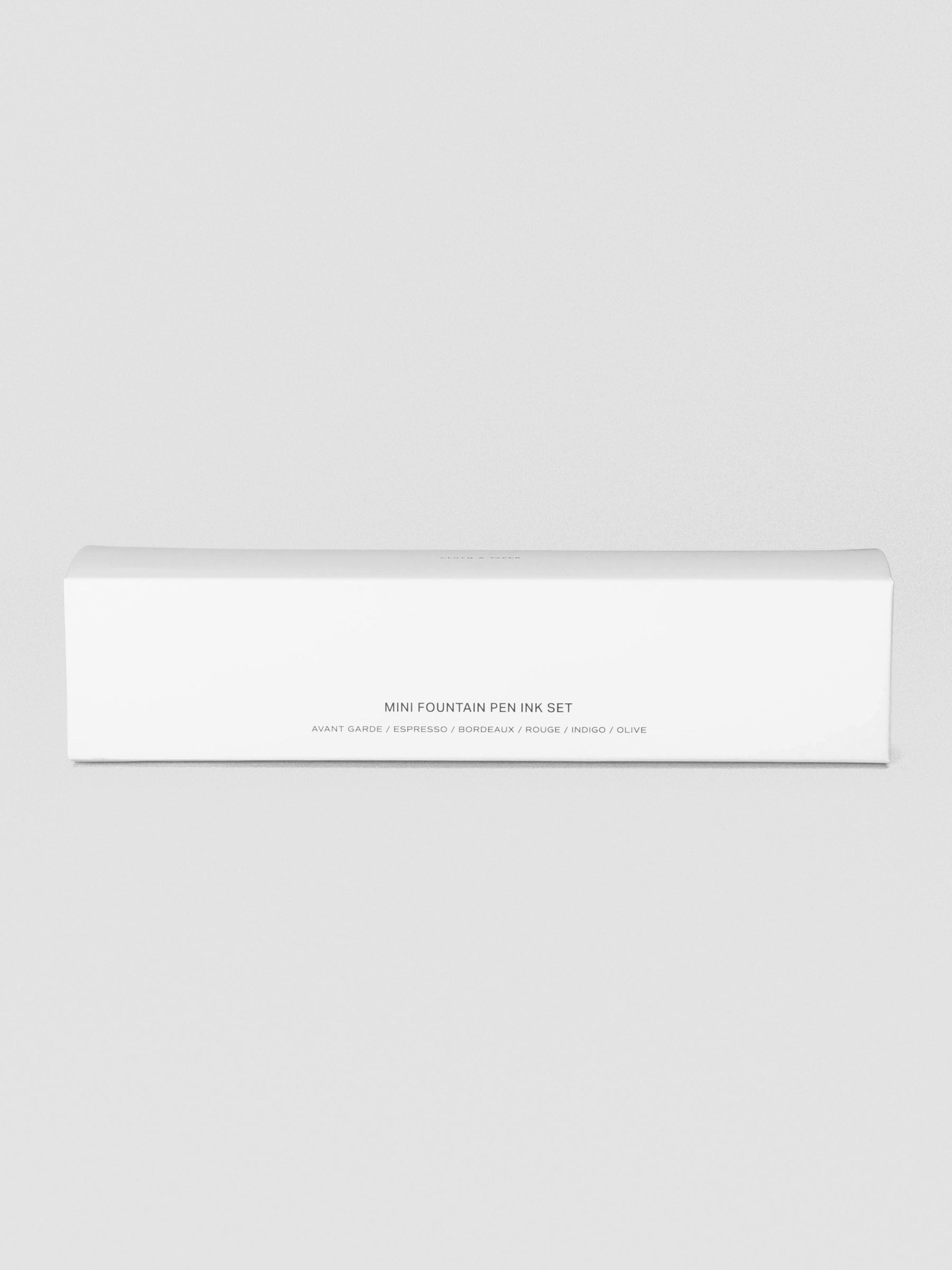 Set of six miniature bottles of fountain pen ink in six unique colors shown in packaging enclosed.