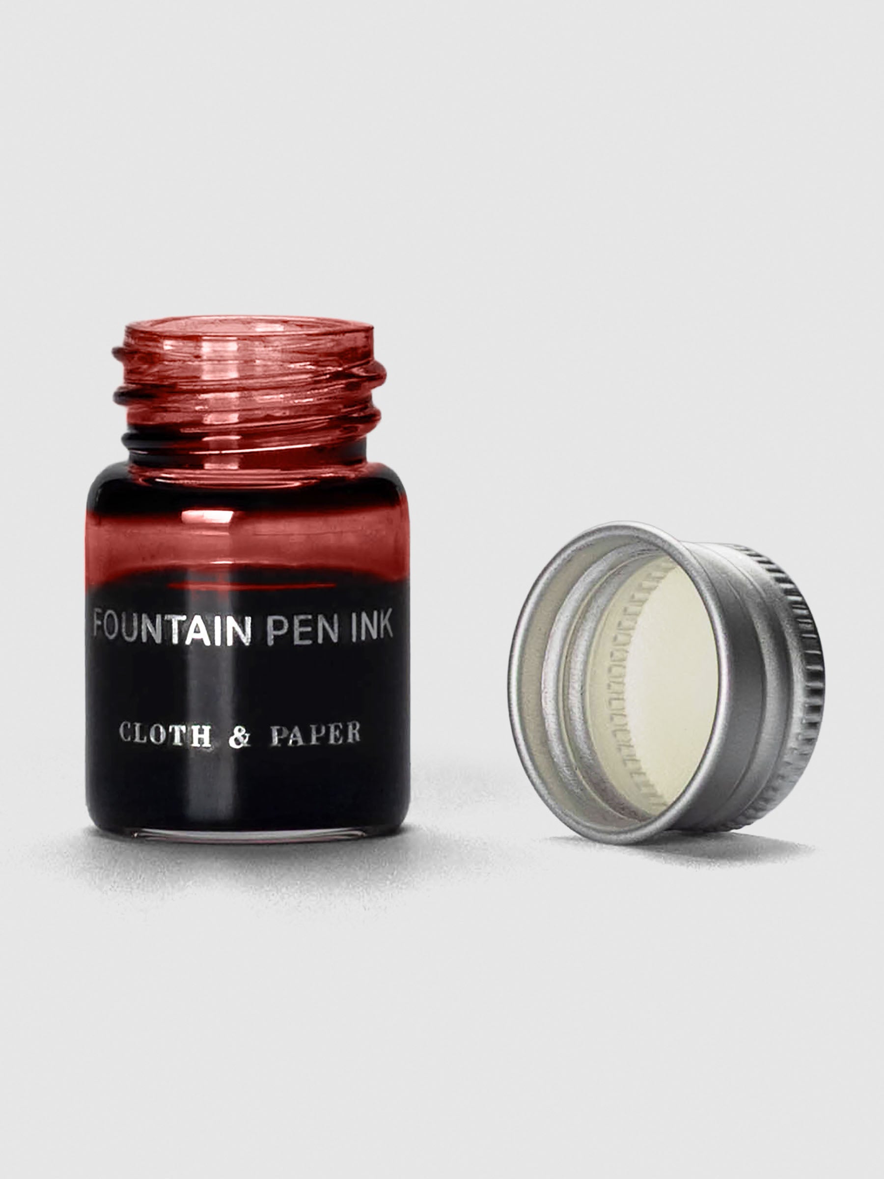 Rouge Mini Fountain Pen Ink shown with cap off bottle.