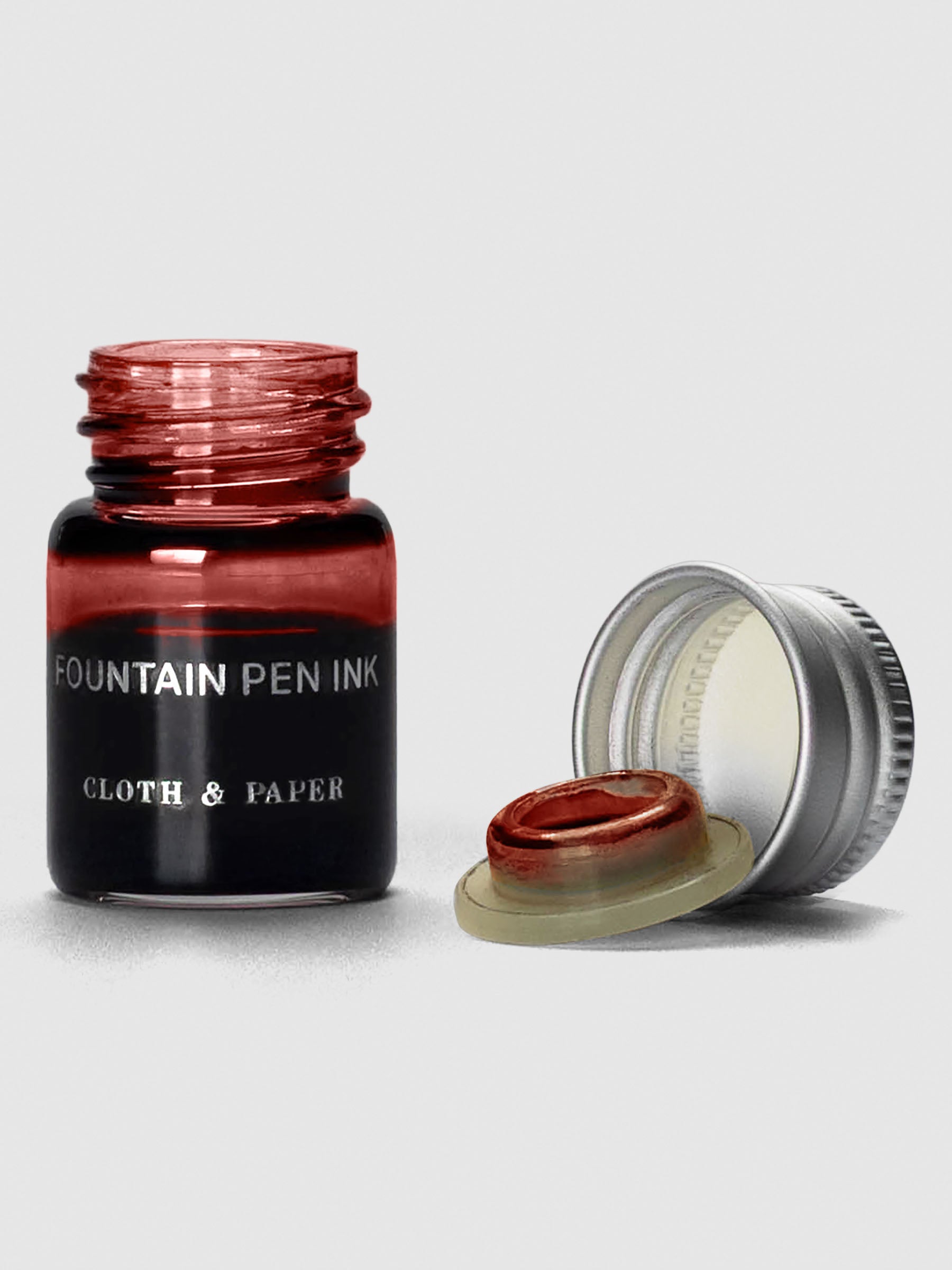 Rouge Mini Fountain Pen Ink shown with cap off bottle.