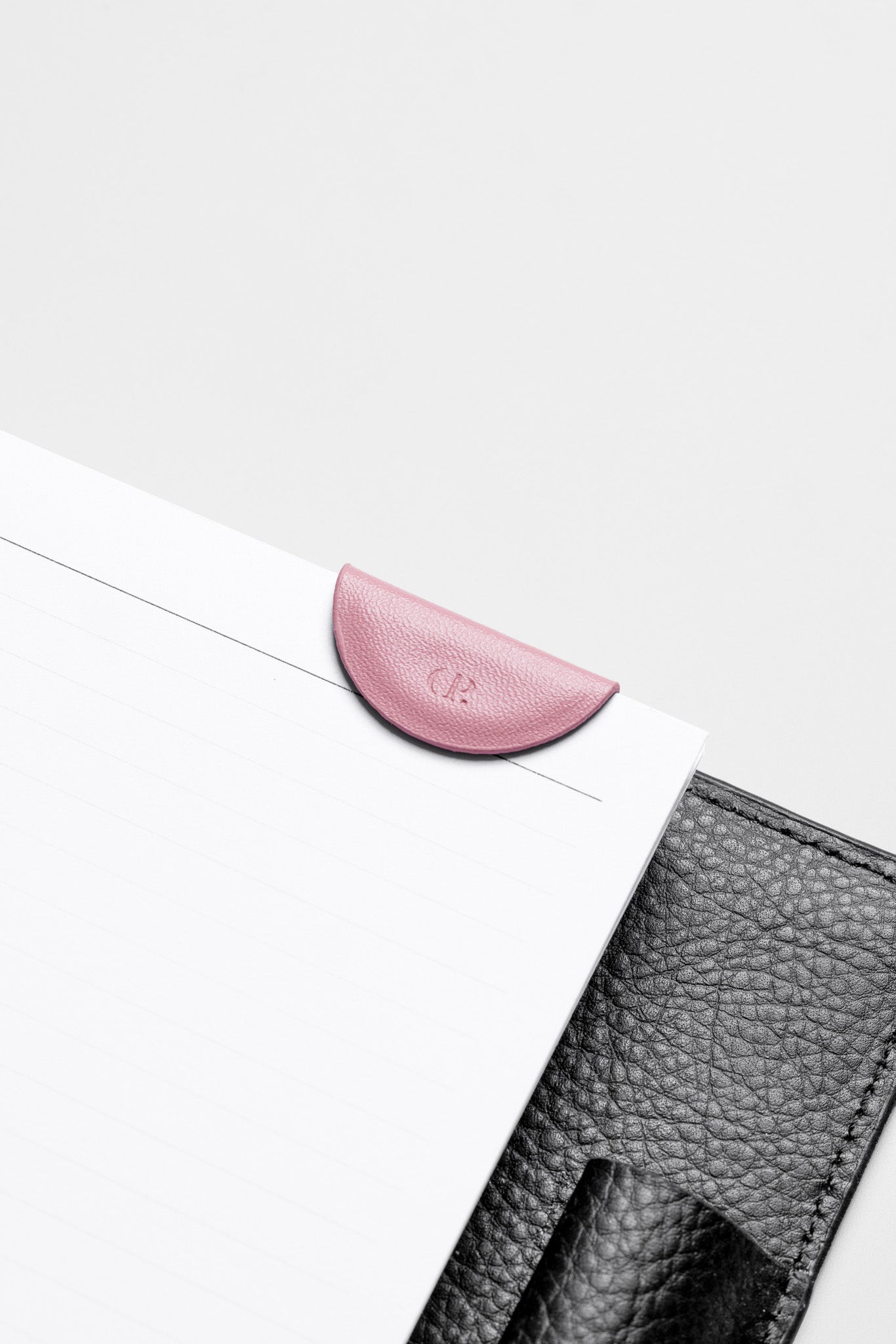 Mini Magnetic Bookmark in the color Fig Milk attached to the inside of a planner.