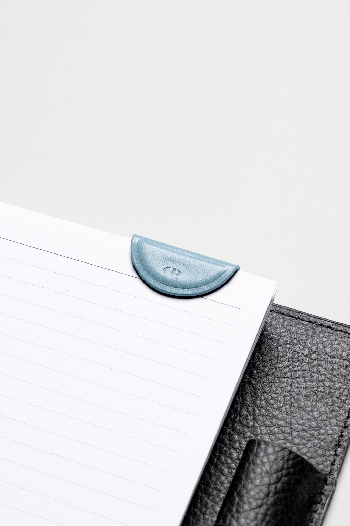 Mini Magnetic Bookmark in the color Smoked Salt attached to the inside of a planner.