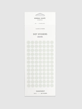 Angora dot stickers in their packaging on a neutral background.