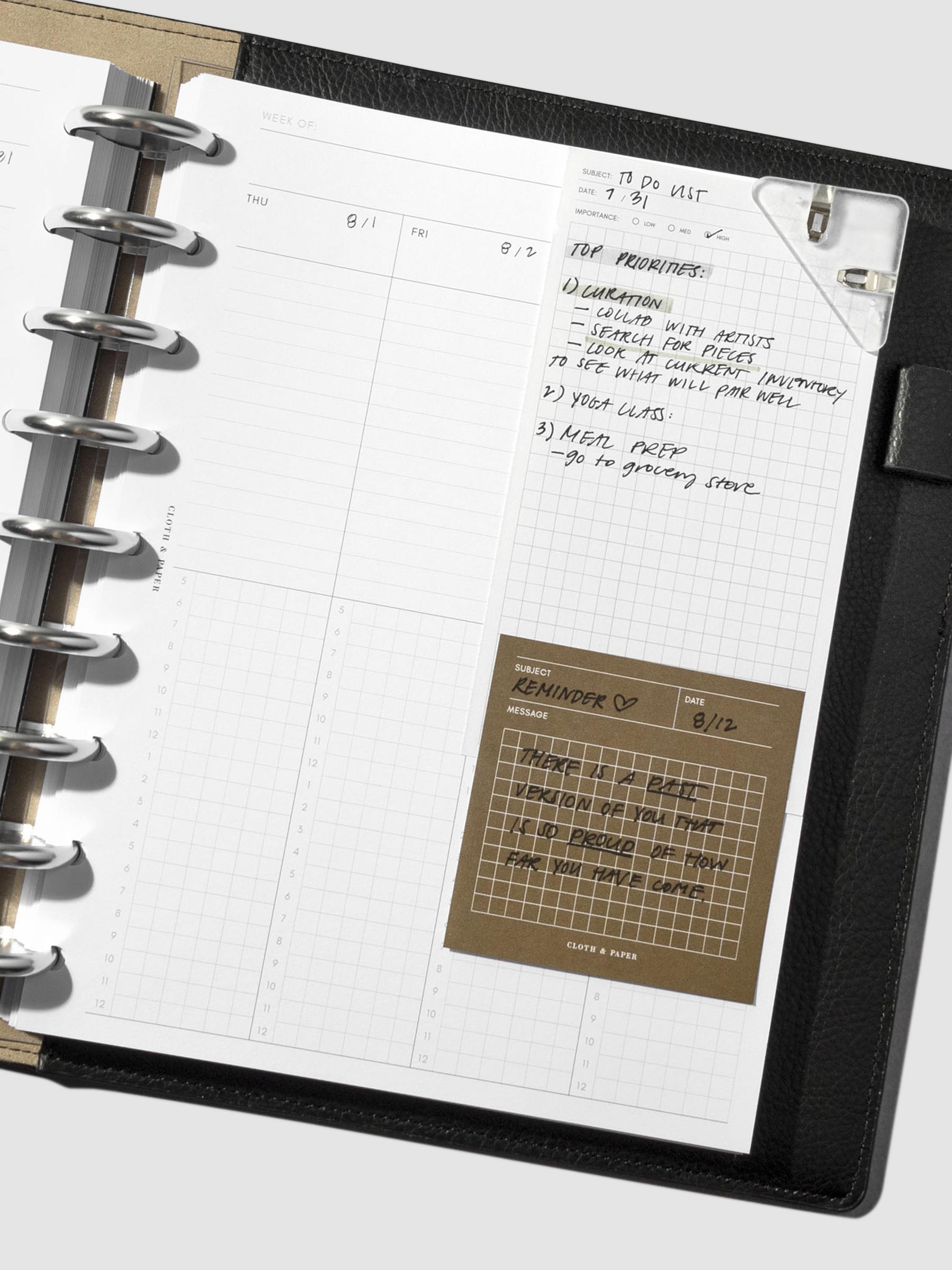 Clip shown in use inside a leather folio.