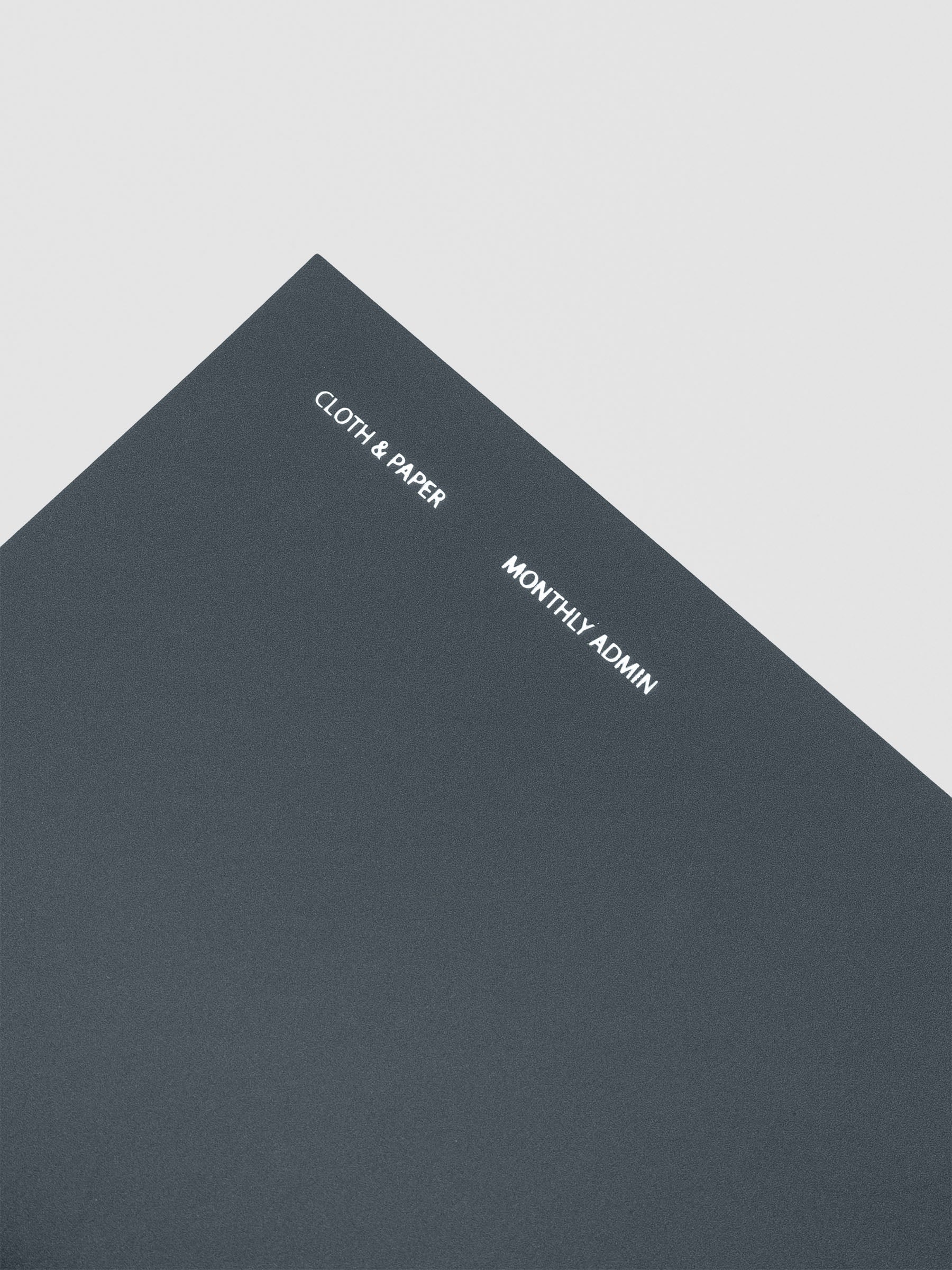 Travel Notebook in size A5 Slim in color Lagoon with Monthly Admin pages shown from the front.