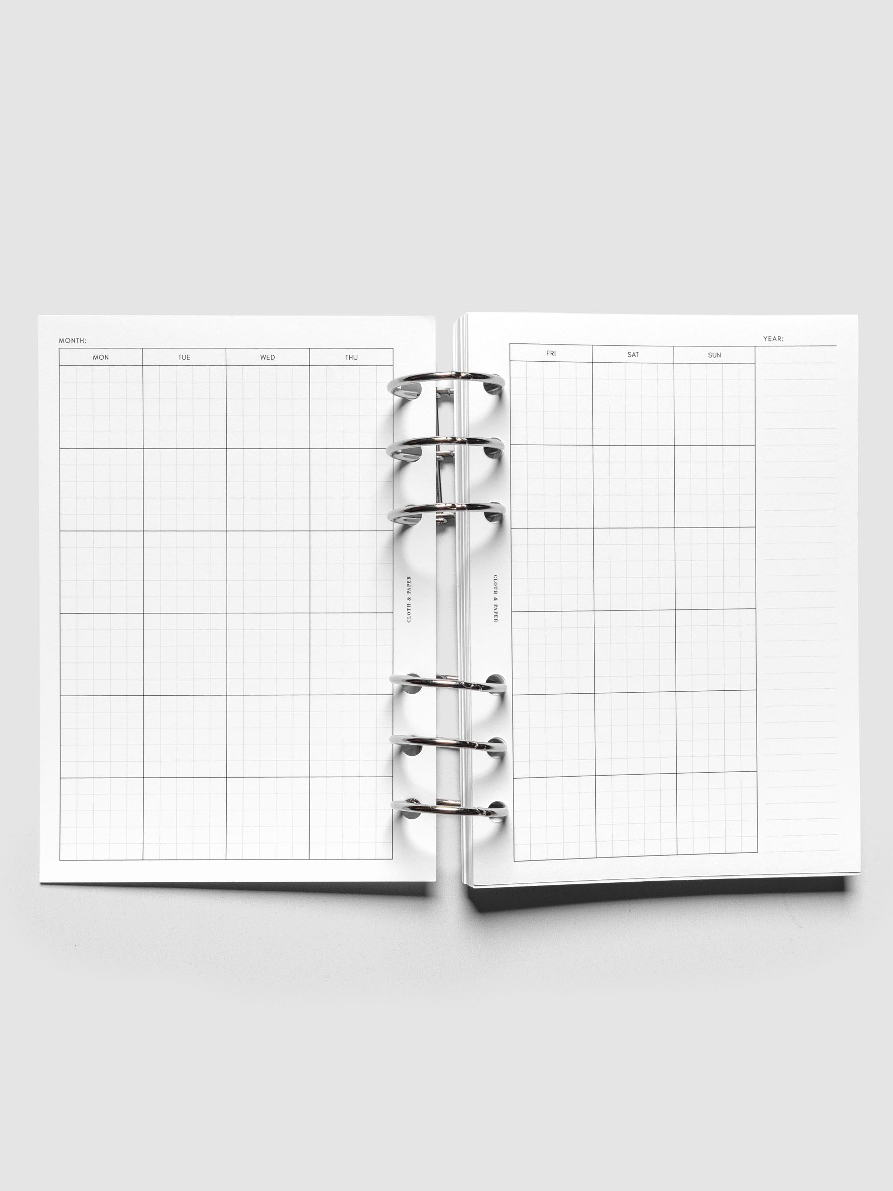 A6 Monthly Graph Planner Inserts shown ringbound.