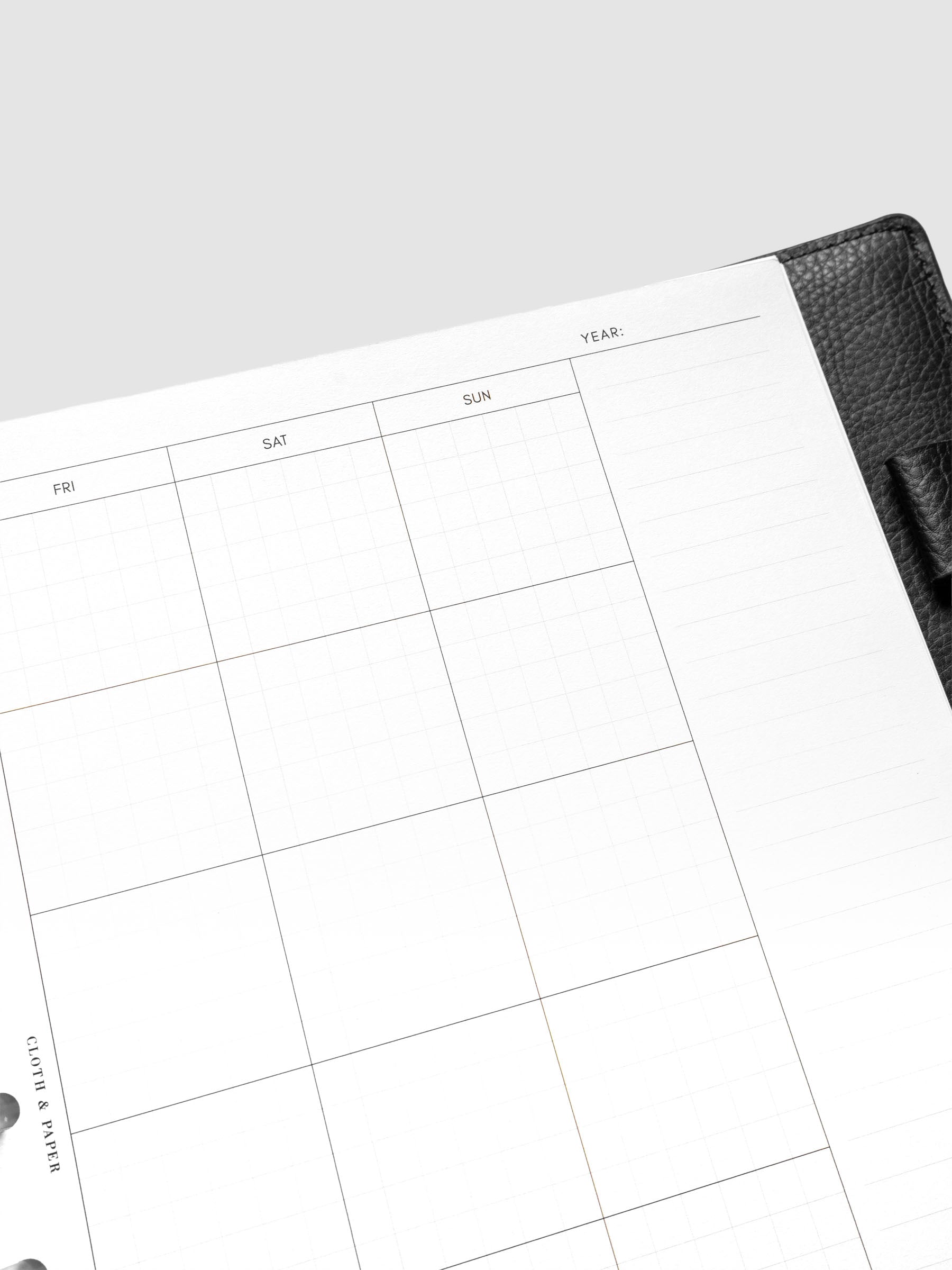 Close up of the Monthly Graph Planner Inserts showing a calendar view of the month with graph note style interior.