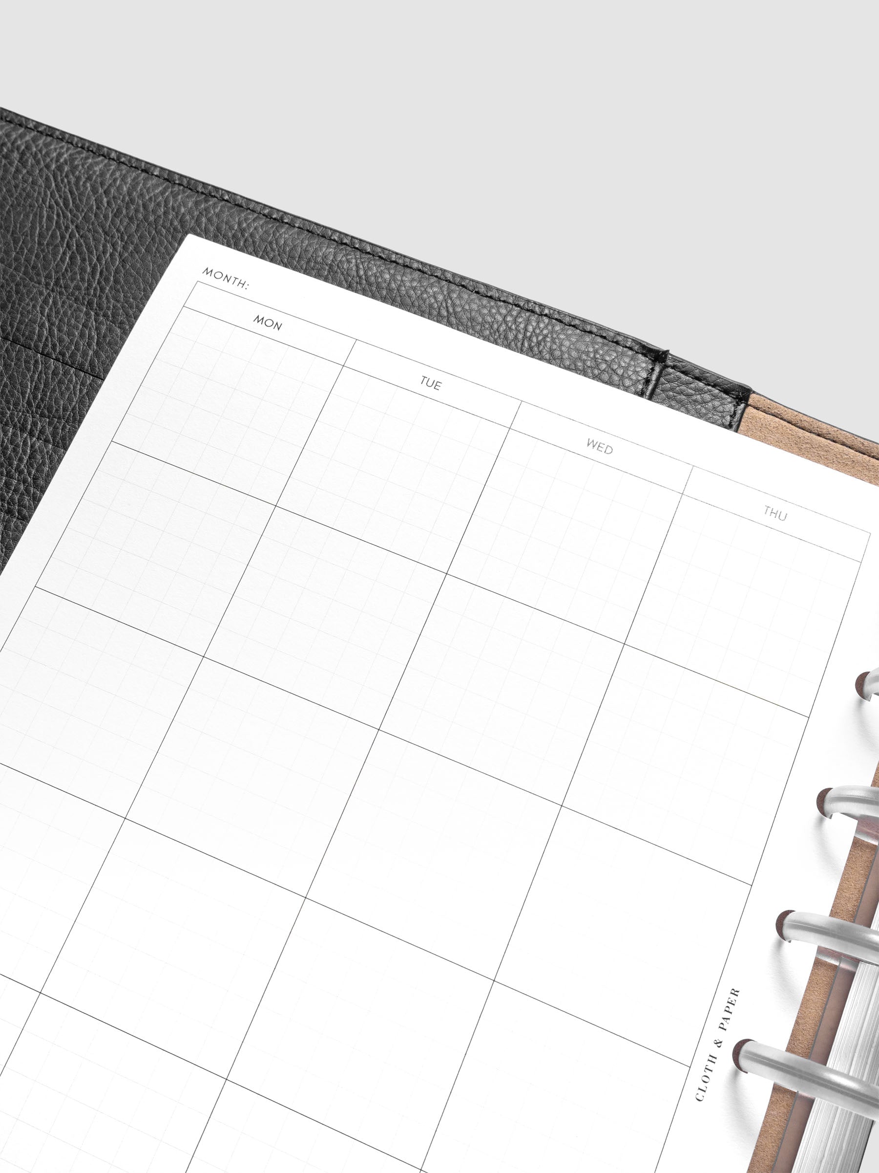 Close up of the Monthly Graph Planner Inserts showing a calendar view of the month with graph note style interior.