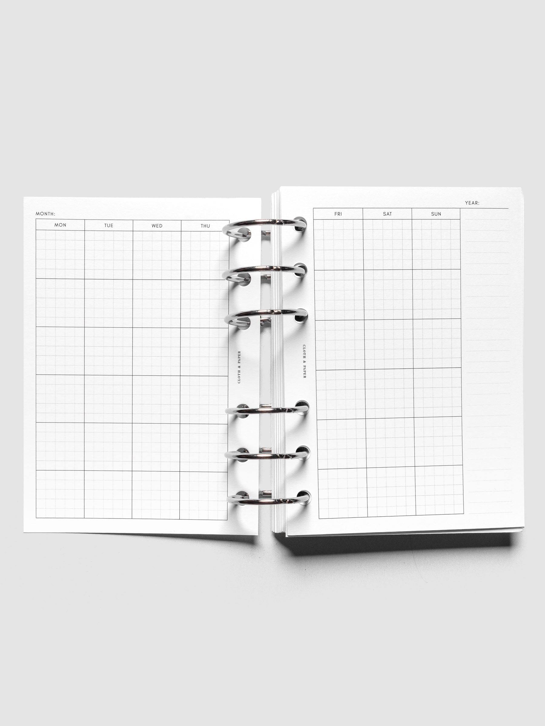 Personal Wide Monthly Graph Planner Inserts shown ringbound.