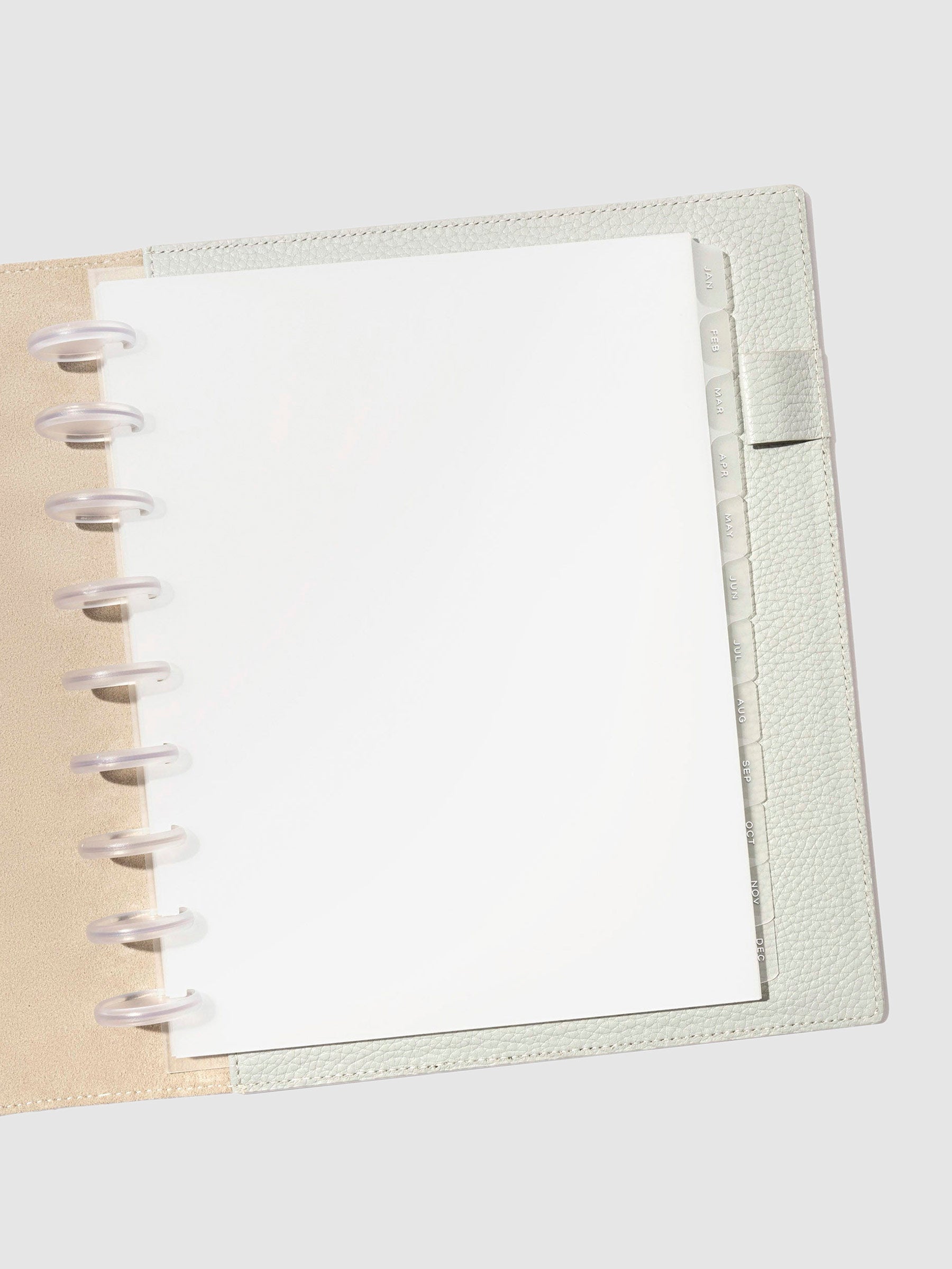 White foil tabs displayed in use inside a leather folio.